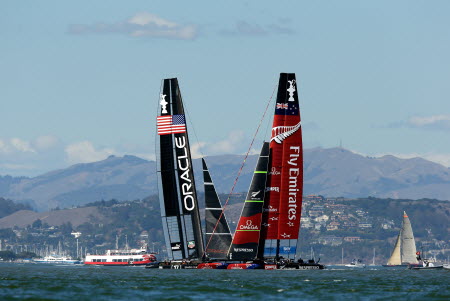 Emirates Team New Zealand skippered by Dean Barker and Oracle Team USA skippered by James Spithill position themselves before race 16 of the America's Cup Finals. Photo: AFP