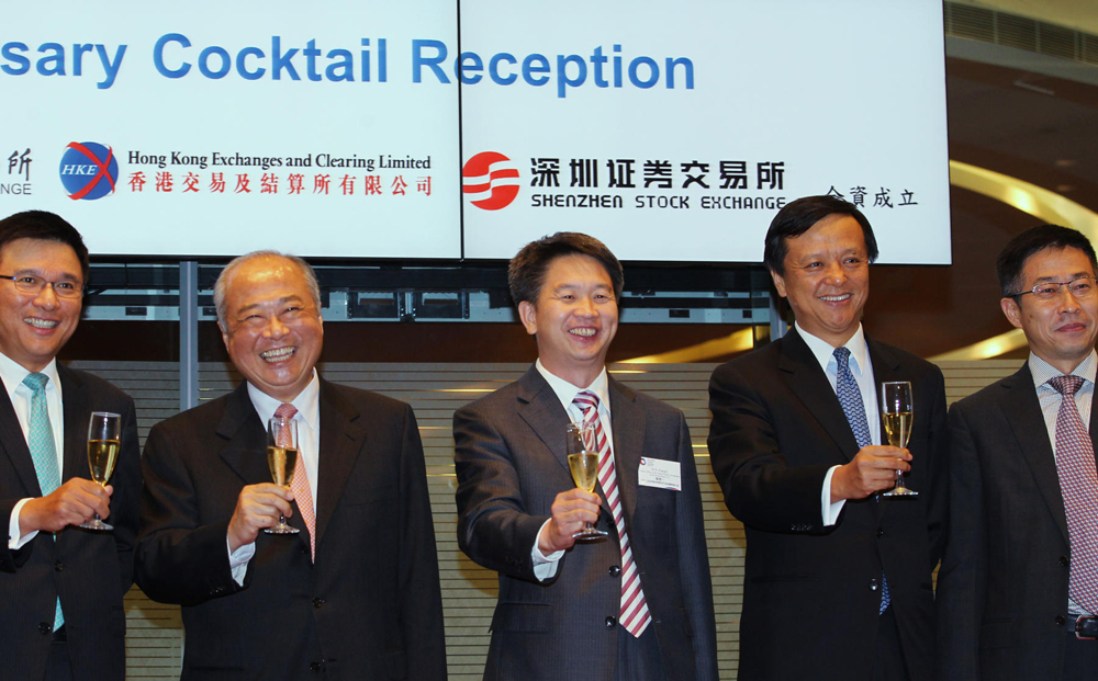 Charles Li (second from right) celebrates the first anniversary of China Exchanges Services Co (CESC) with (from left) Secretary for Financial Services and the Treasury Chan Ka-keung, Chow Chung-kong from HKEx, Liaison Office's Sun Xiangyi and CESC's Fu Dewei. Photo: Nora Tam