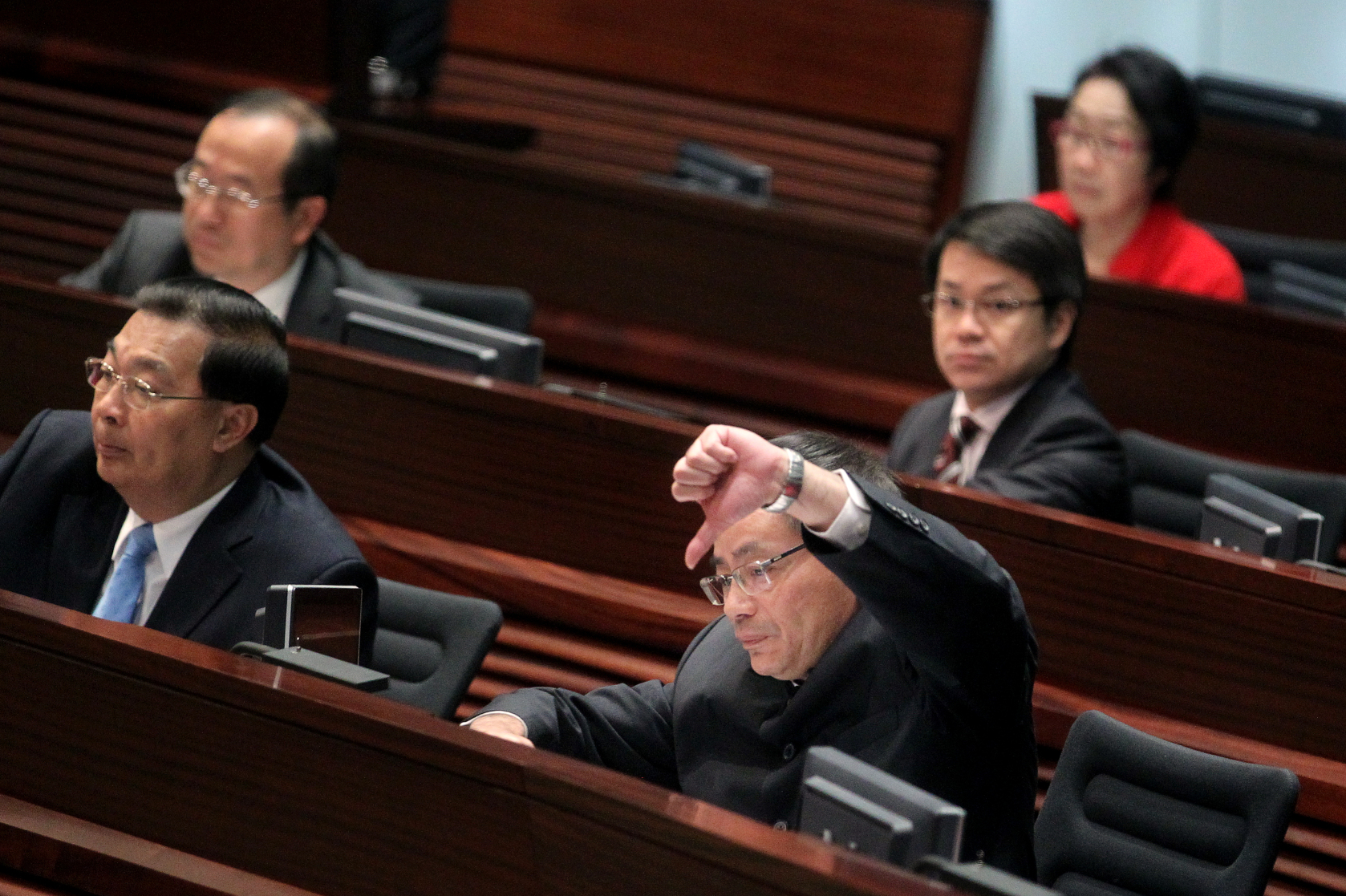 Lawmaker Ip Kwok-him gives the thumbs down at a debate in Legco. Photo: K.Y. Cheng