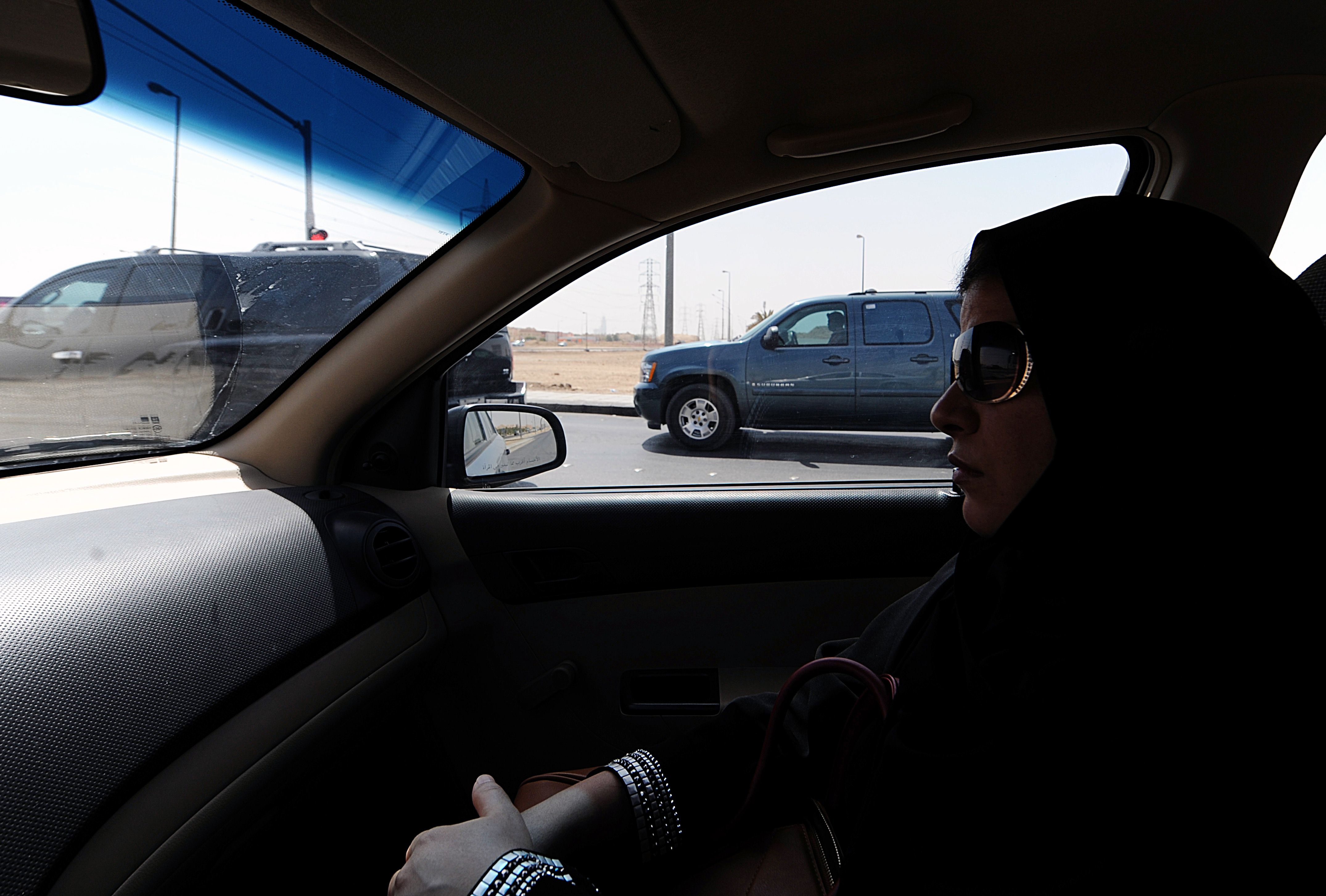 A Saudi woman sits in a vehicle as a passenger in Riyadh. A top cleric has said women who drive risk bearing children with clinical problems. Photo: AFP