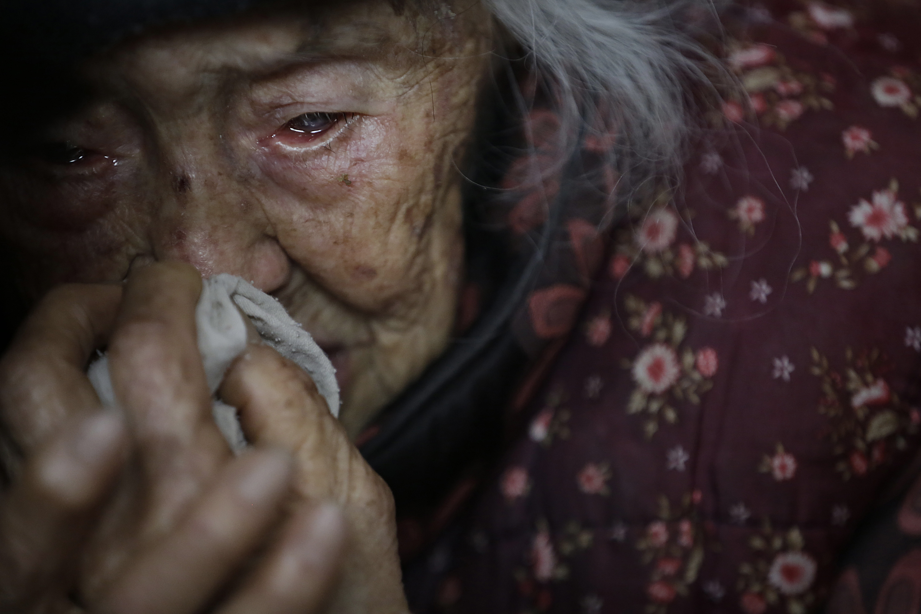 Zhang Zefang, 94, who sued her own children for not taking care of her, cries as she describes the miseries she has endured throughout her life. Photo: AP