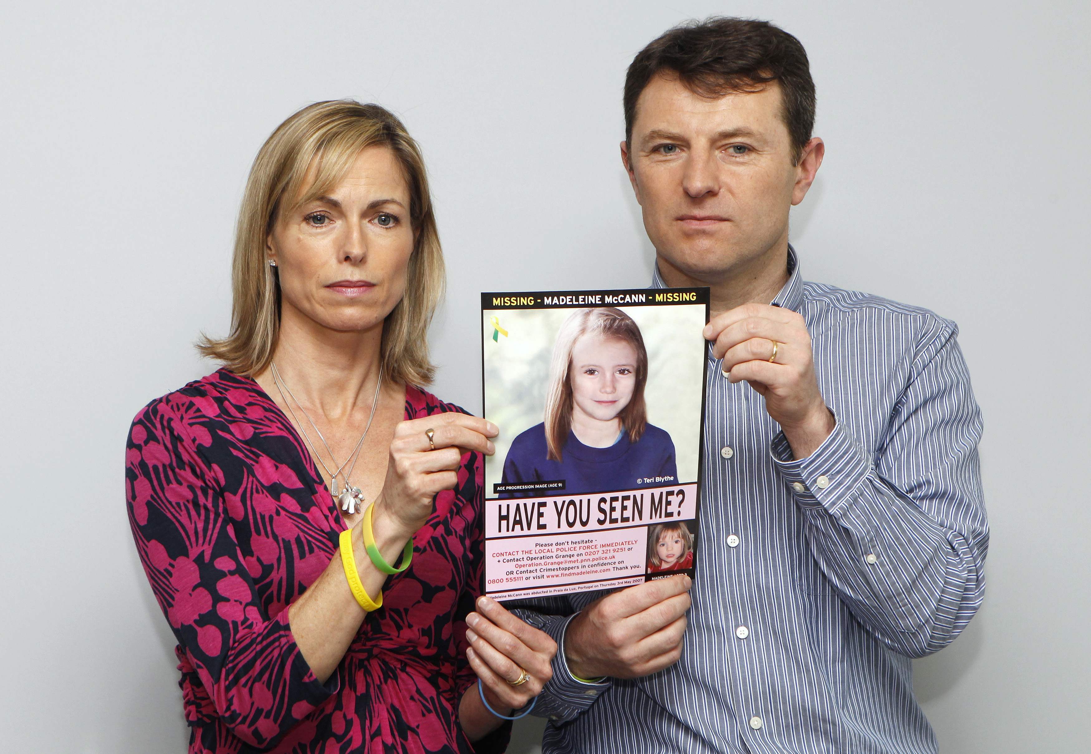 Kate and Gerry McCann are seen posing with a computer generated image of how their missing daughter Madeleine might look. Photo: Reuters
