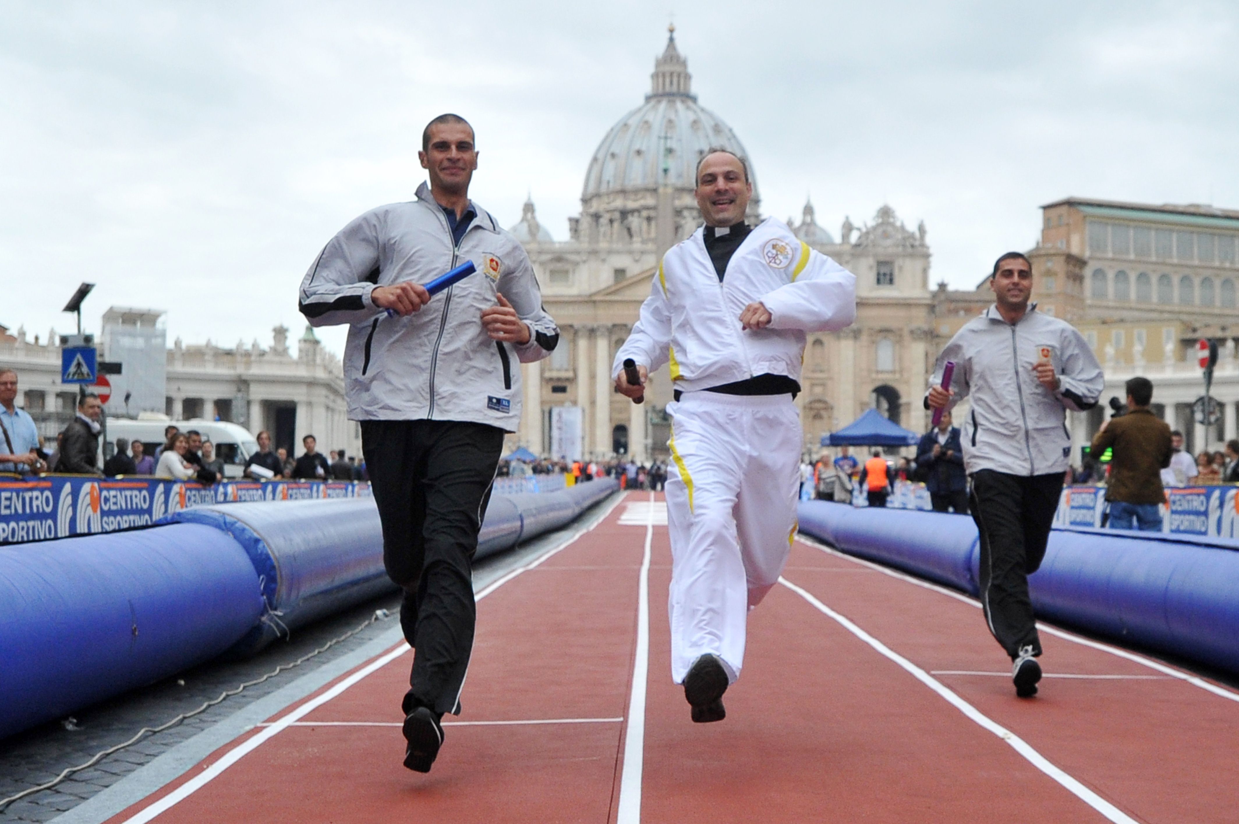 Competitors take part in a "Race of Faith" in St Peter's Square at the Vatican on Sunday. Photo: AFP 