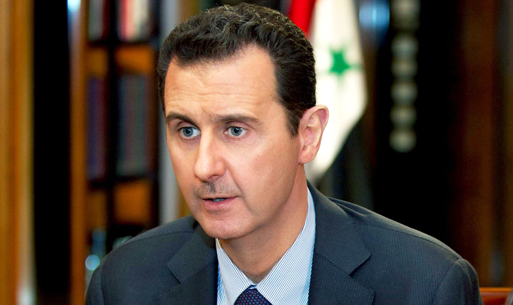 President Bashar al-Assad speaking during a television interview in Damascus on Sunday. Photo: EPA