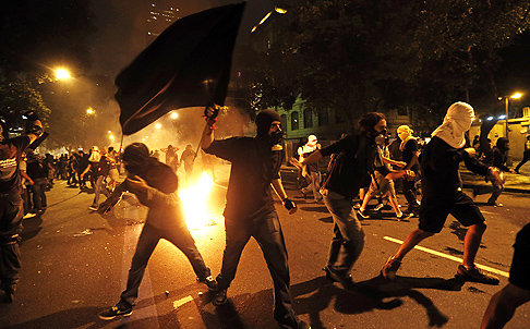 Masked members of the so-called Black Bloc anarchist group in Rio de Janeiro. Photo: AP