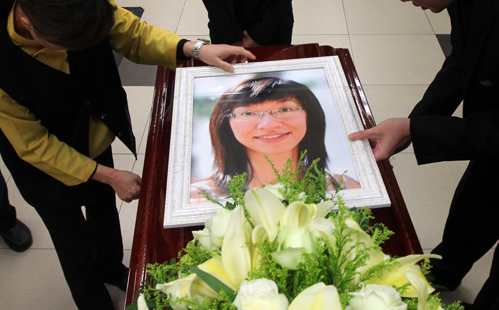 A photo of Colette Tsang Shi-lok, a doctor of Tuen Mun Hospital who was killed in Shenzhen on Christmas Day, is seen at her funeral at Universal Funeral Parlour, Hung Hom. Photo: Felix Wong