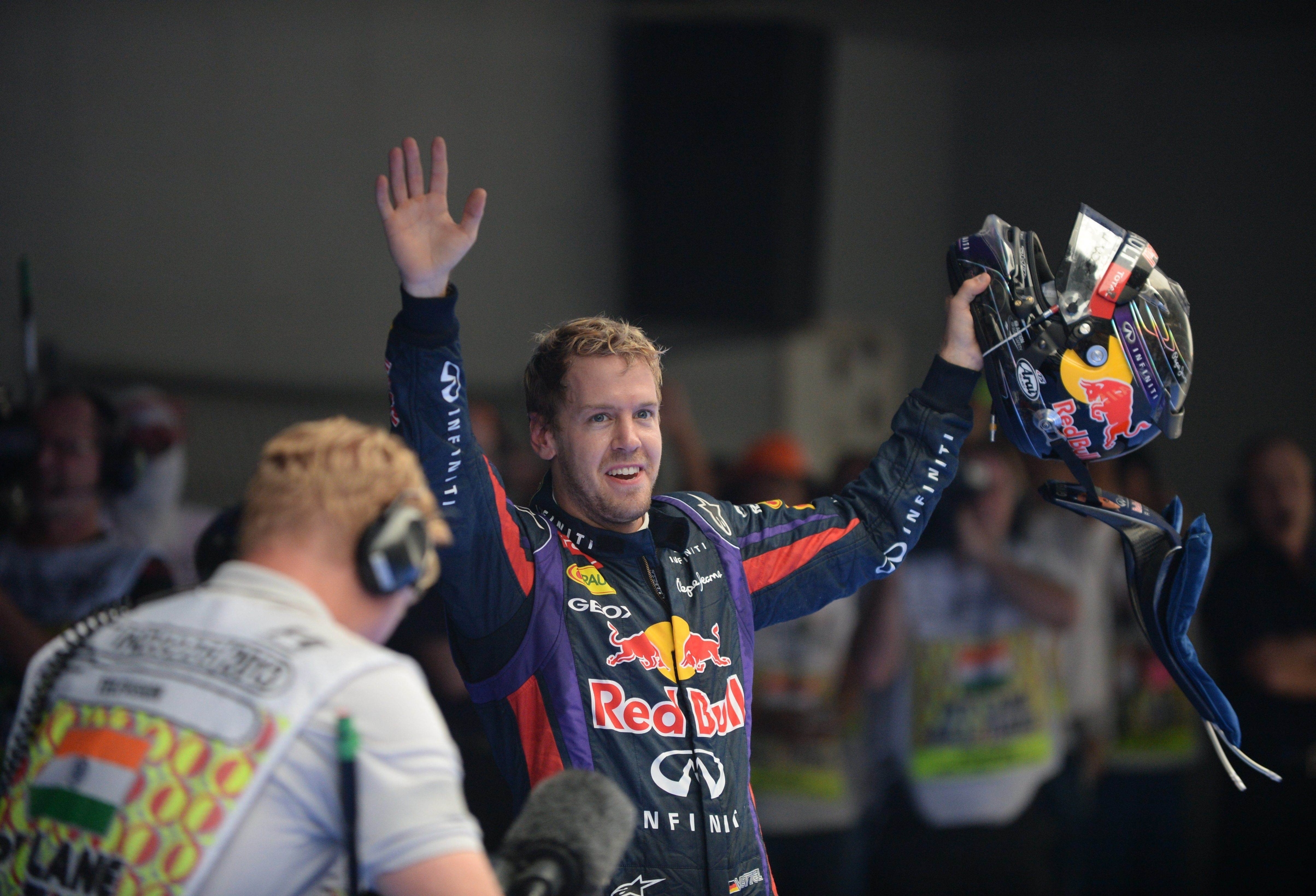 Sebastian Vettel celebrates after winning his fourth straight Formula One title. Photo: AFP 