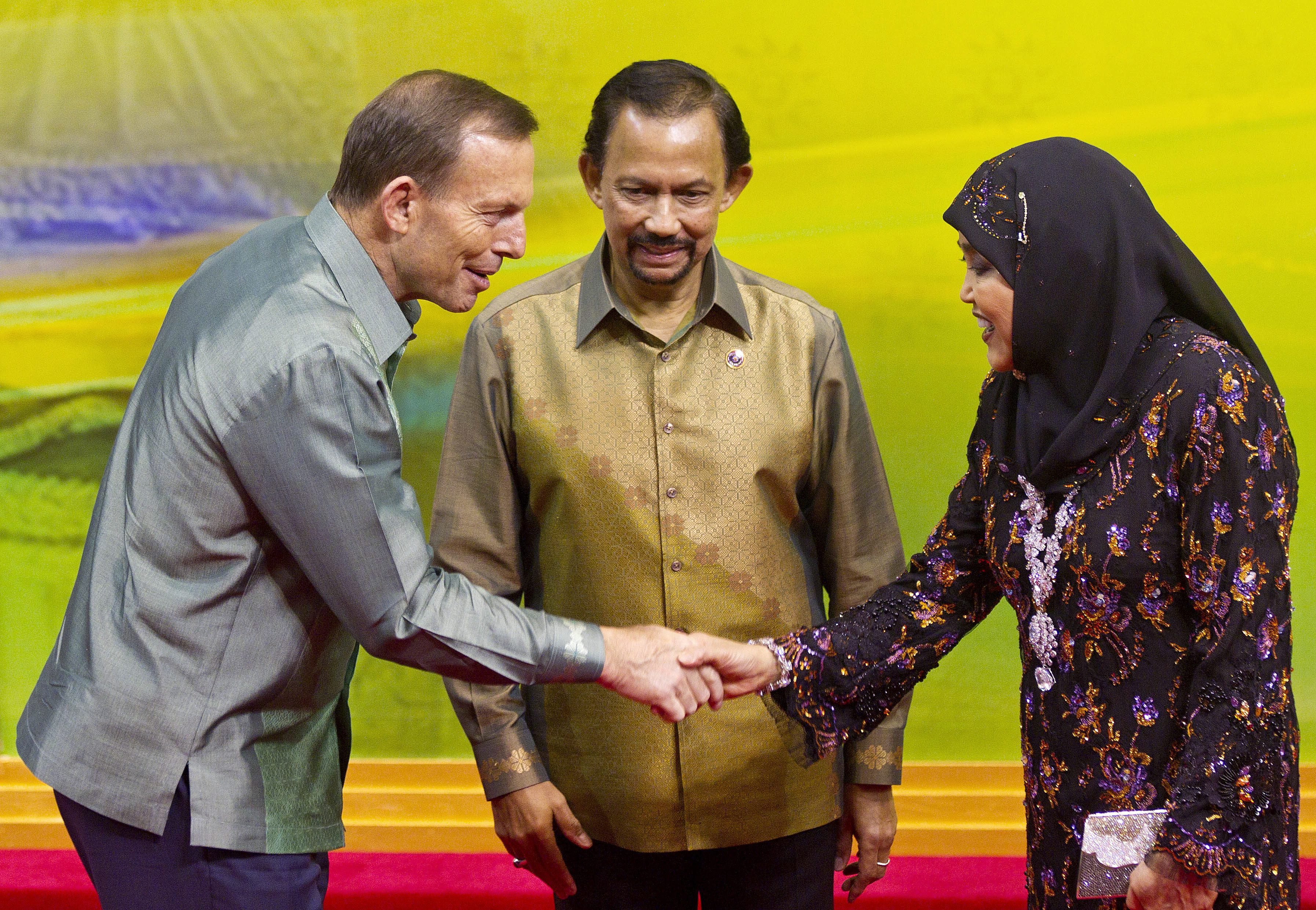 Tony Abbott meets Brunei's Sultan Hassanal Bolkiah and his wife at the Asean summit. Photo: EPA
