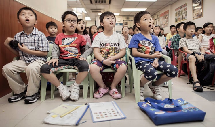 Children attending a class to learn how to speak English with an American accent at the Nature EQ school in Hong Kong. Photo: AFP