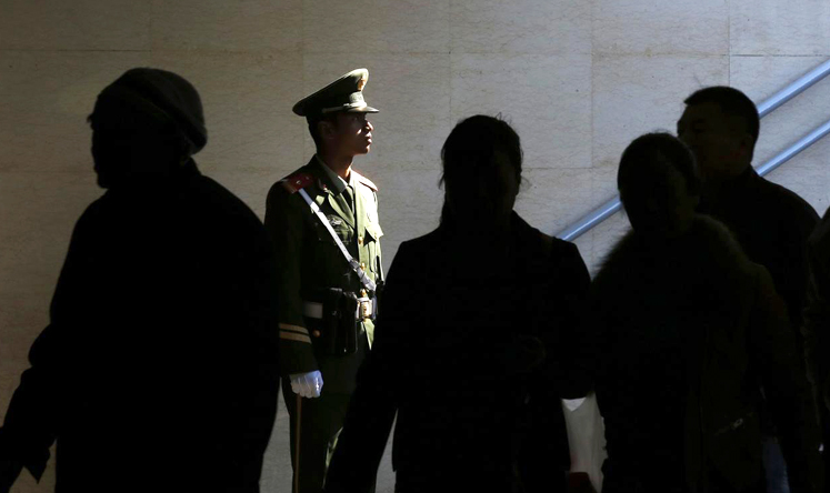 A policeman stands guard in a passageway connecting Tiananmen Square to the Forbidden City in Beijing. Photo: Reuters