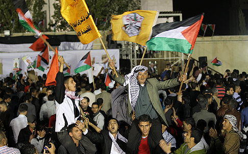 Palestinians celebrate the release of 26 militants from Israeli prisons in the West Bank town of Ramallah on Wednesday.