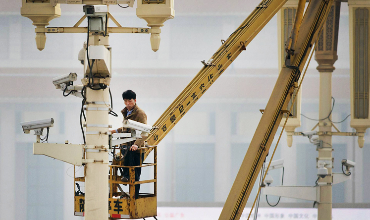 A worker checks on security cameras at Tiananmen Square in Beijing yesterday in the aftermath of Monday's terrorist attack. Photo: AFP
