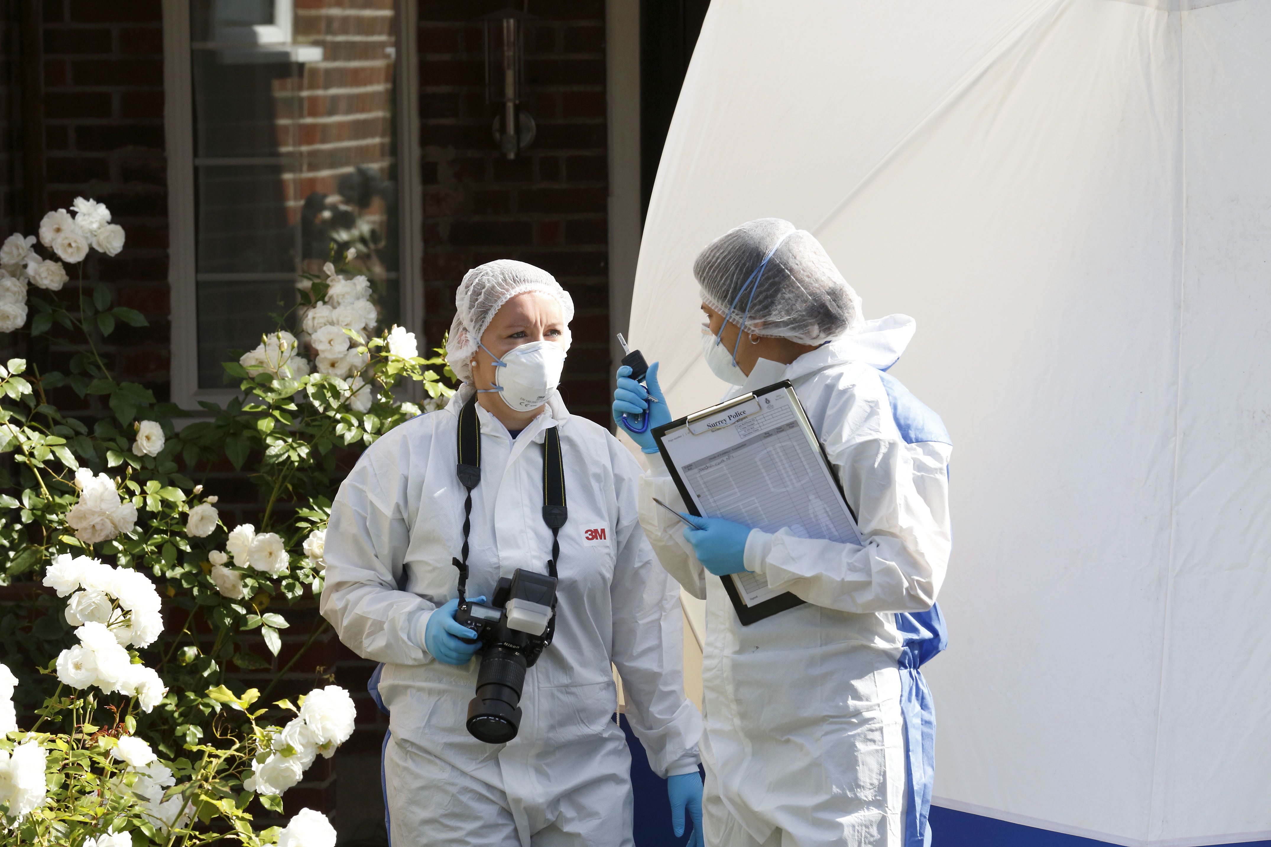 British forensic officers at the home of the al-Hilli family after the gun attack. Photo: AFP