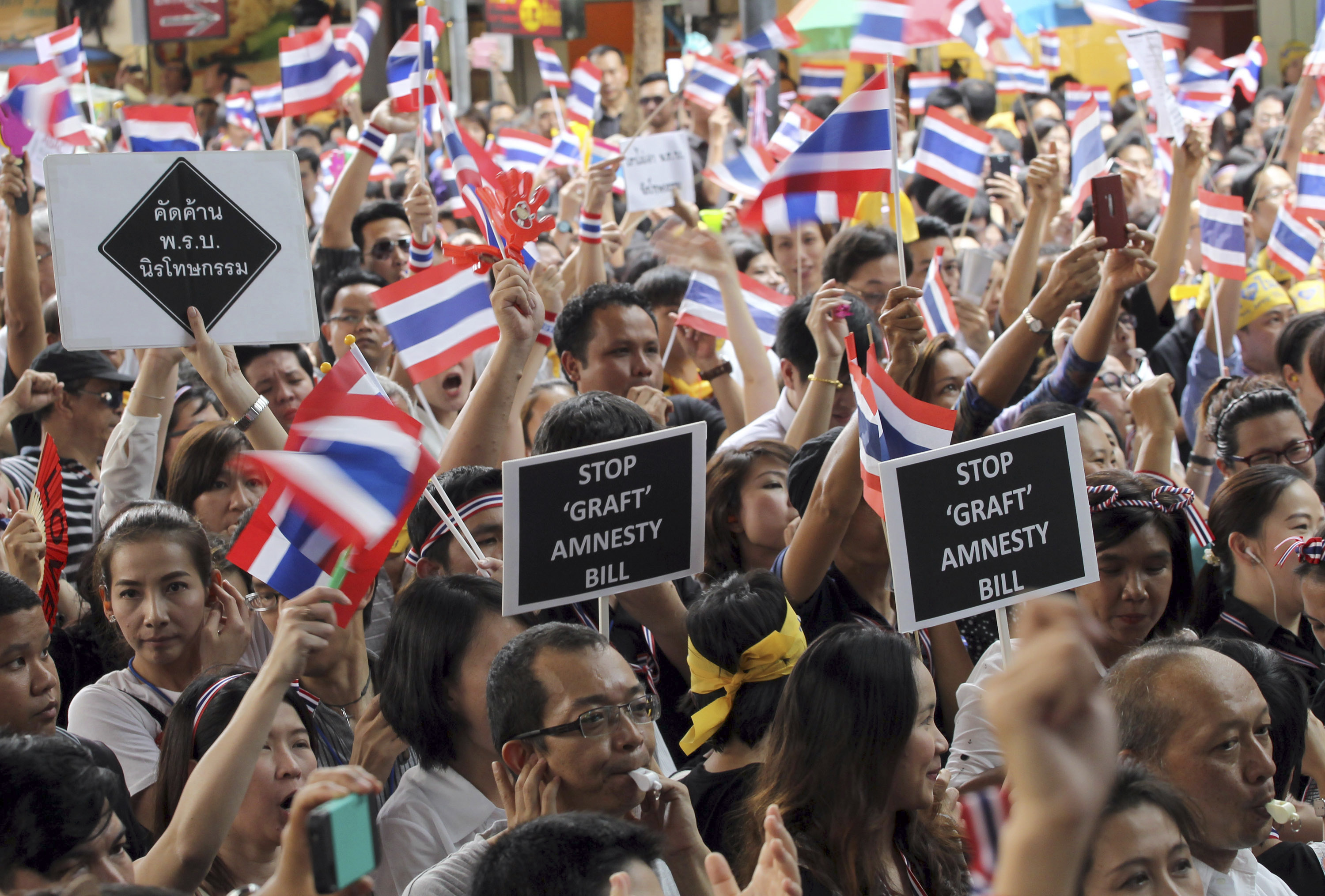 Thai workers at an anti-amnesty bill demonstration in Bangkok on Wednesday. Photo: AP