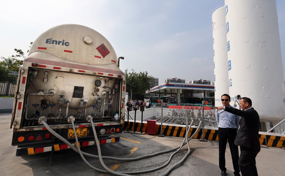 LNG is being pumped into the fuel tank of a public bus LNG refueling station in Shenzhen. Space constraints limit Hong Kong's land available for depots and refilling stations.