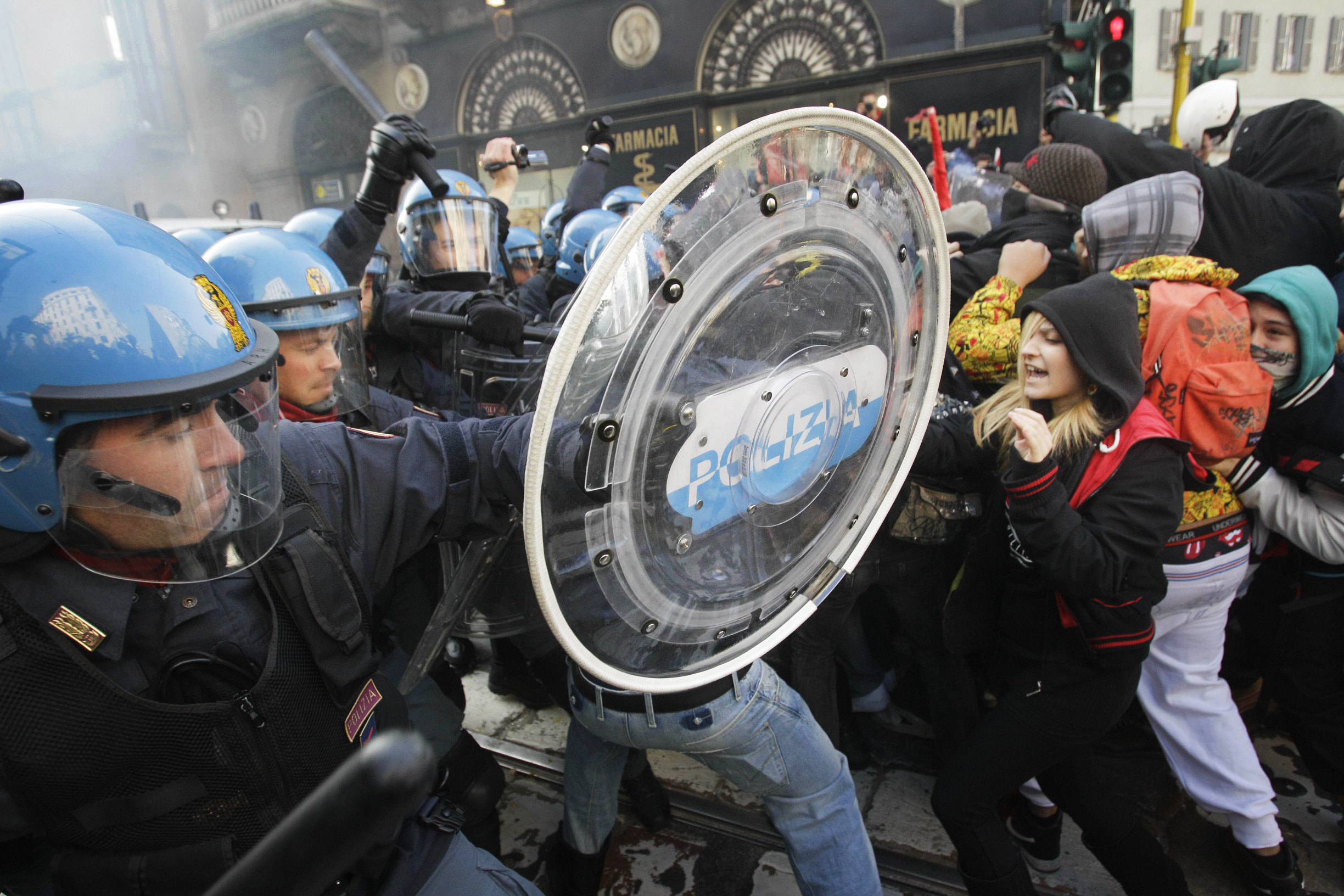 Students clash with police during a demonstration in Milan against budget cuts and a lack of jobs. Photo: AP