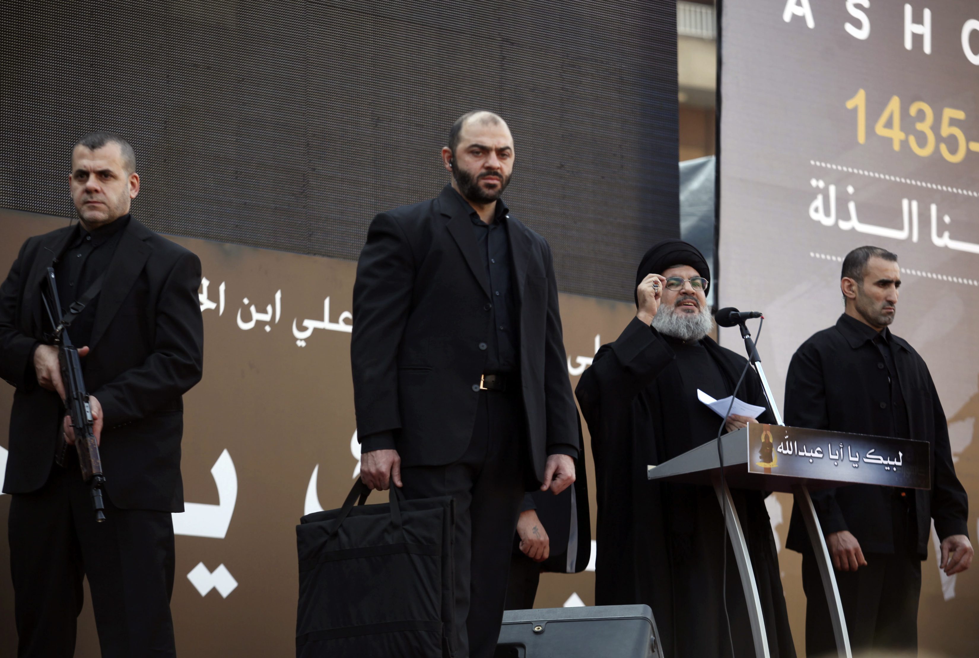 Lebanon's Hezbollah leader Hassan Nasrallah, surrounded by bodyguards, addresses supporters in Beirut on Thursday. Photo: Reuters