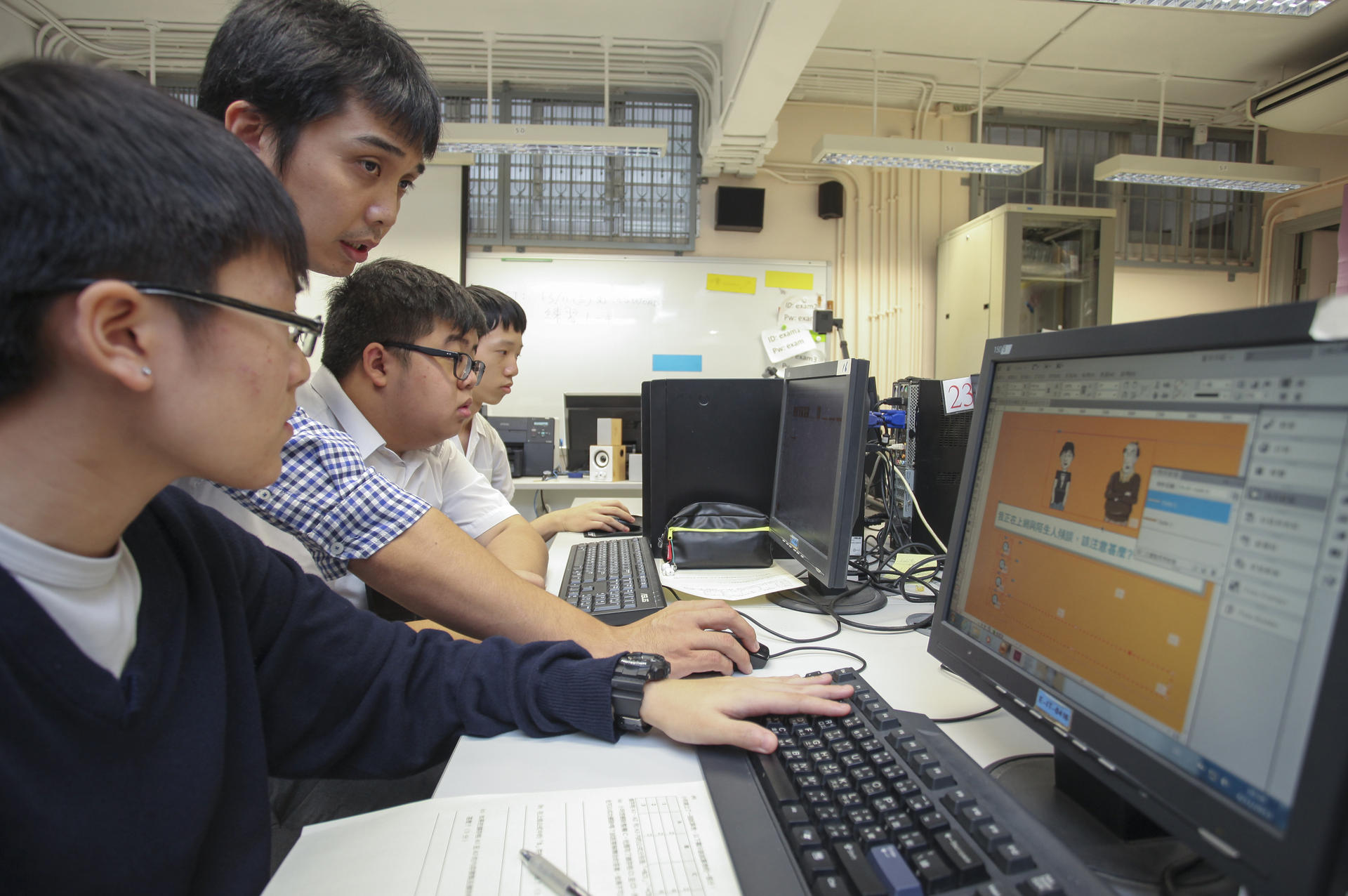 From left: Iris Cheung, IT teacher James Kong, Li Luk-yi and Tim Leung at FHMS. Photo: Paul Yeung