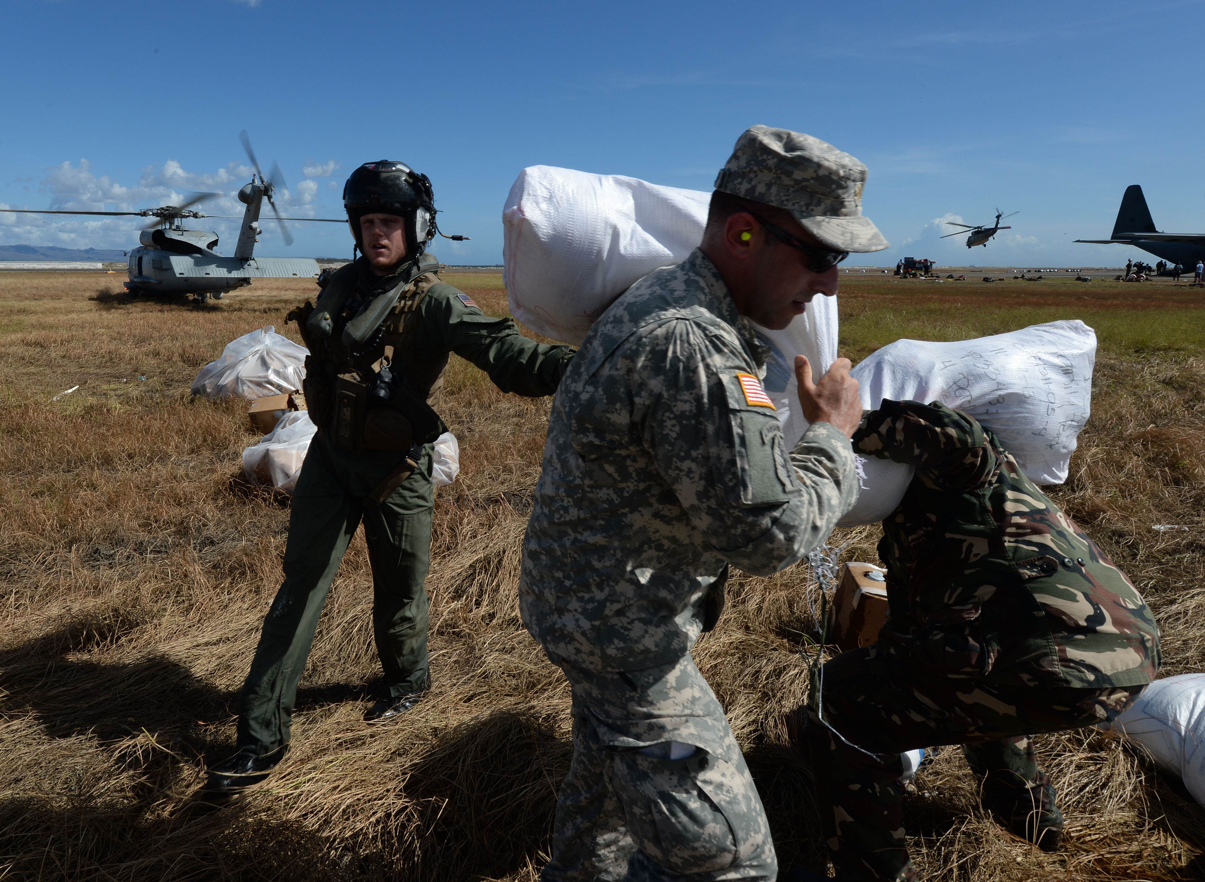 US Marines deliver relief aid at Tacloban airport. Photo: AFP