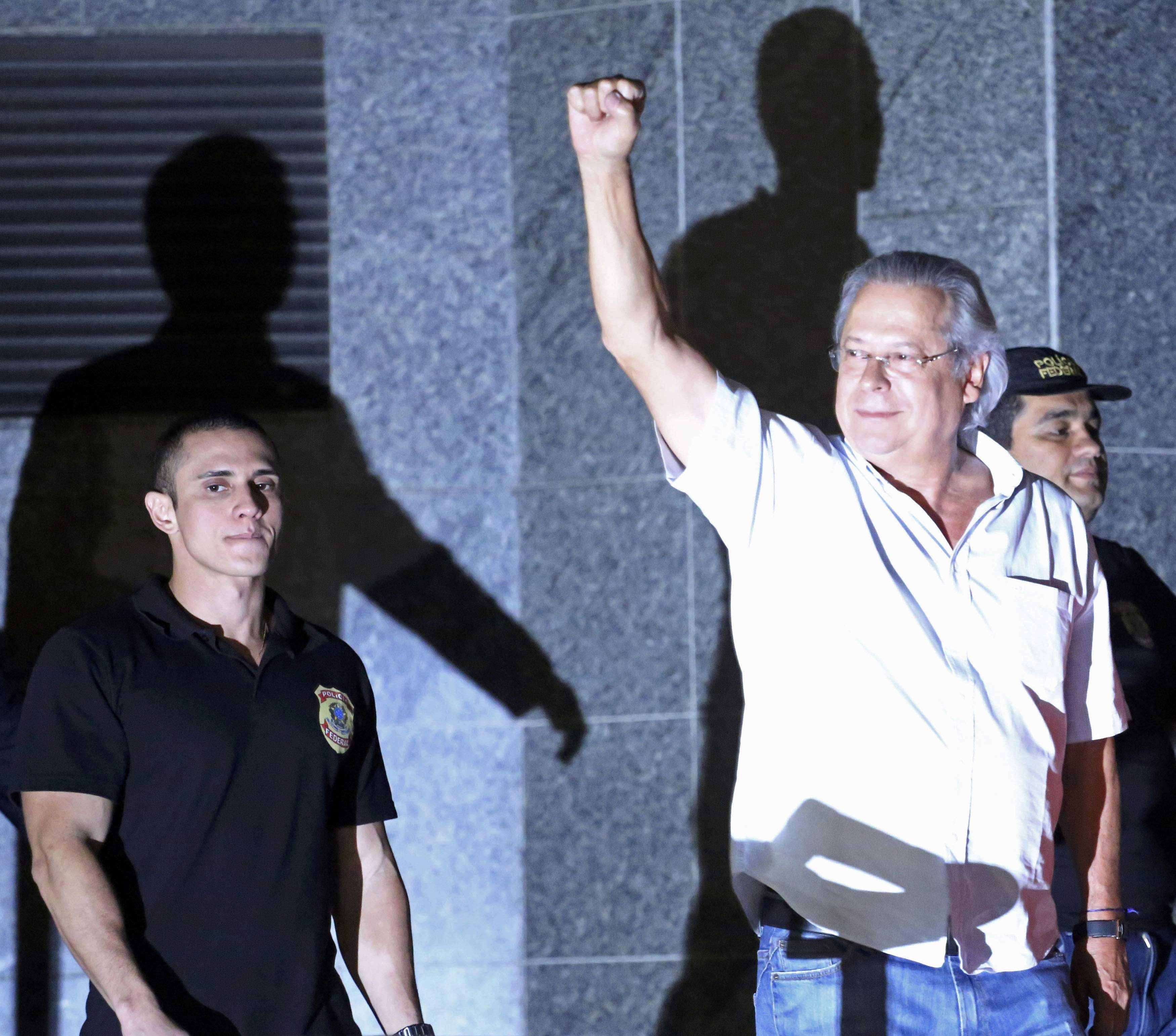 Jose Dirceu (right), chief-of-staff under Brazil's former president Inacio Lula da Silva, turns himself in to police. Photo: Reuters 
