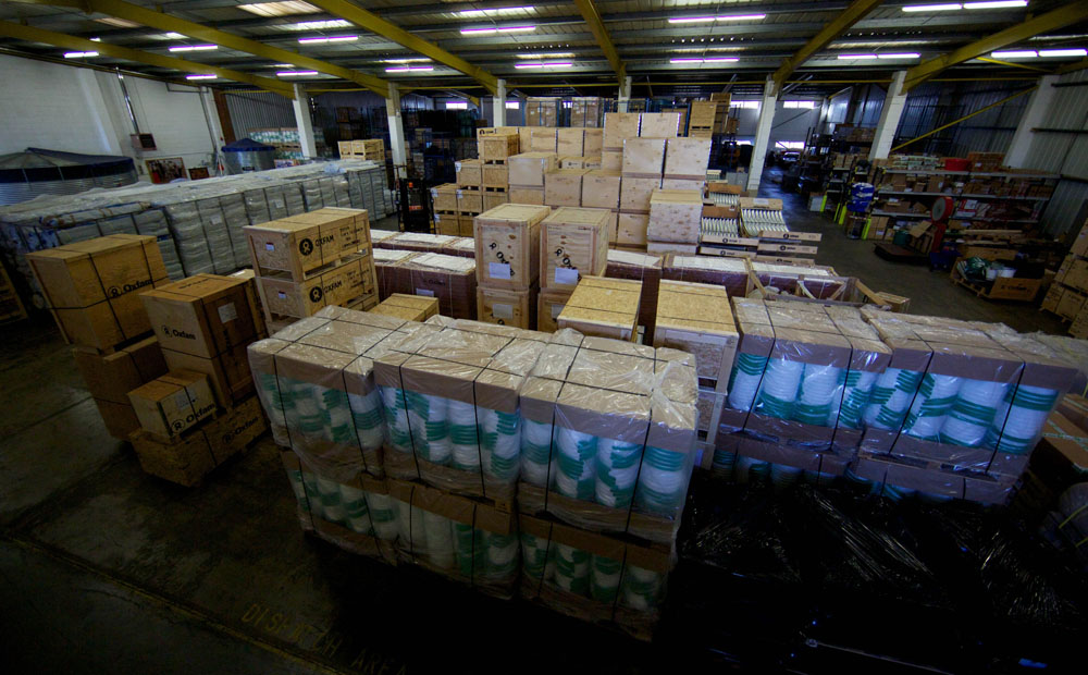Aid packages as part of efforts to assist victims of Typhoon Haiyan are ready to be shipped in an Oxfam UK warehouse. Beijing's initial US$200,000 donation to the Philippines has drawn criticism. Photo: AFP