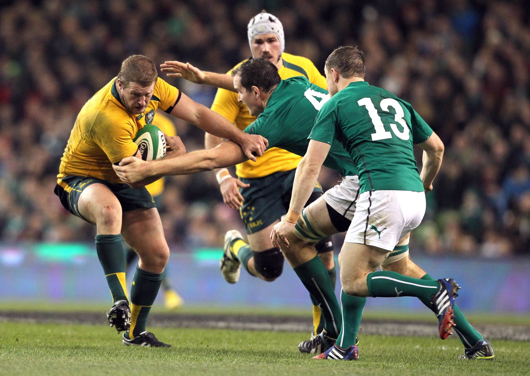 Australia's prop James Slipper is tackled by Ireland's lock Devin Toner and centre Brian O’Driscoll during the match between Ireland and Australia at Aviva Stadium in Dublin. Photo: AFP