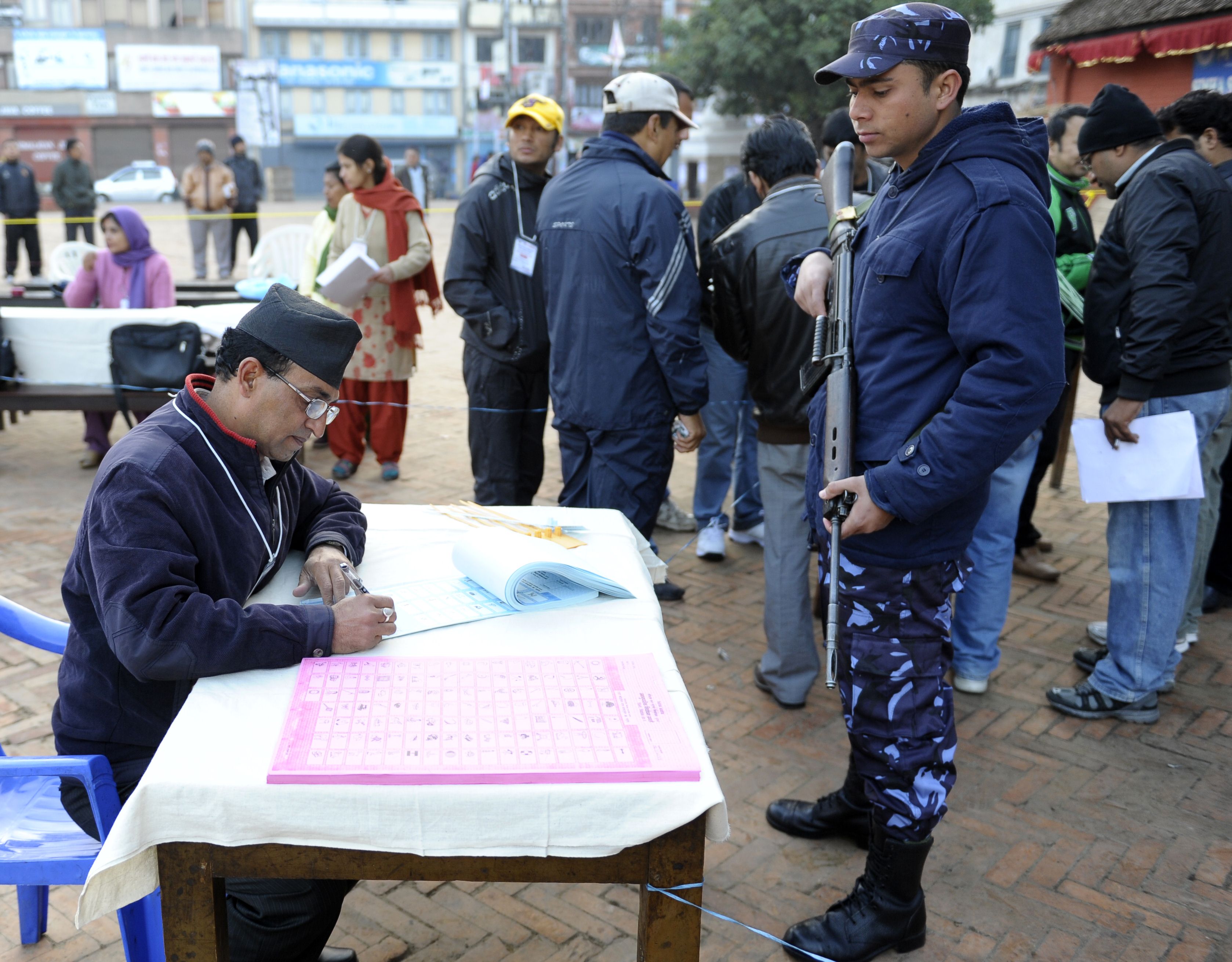A Nepalese election official prepares ballots as voting begins at a polling station in Kathmandu. Photo: AFP
