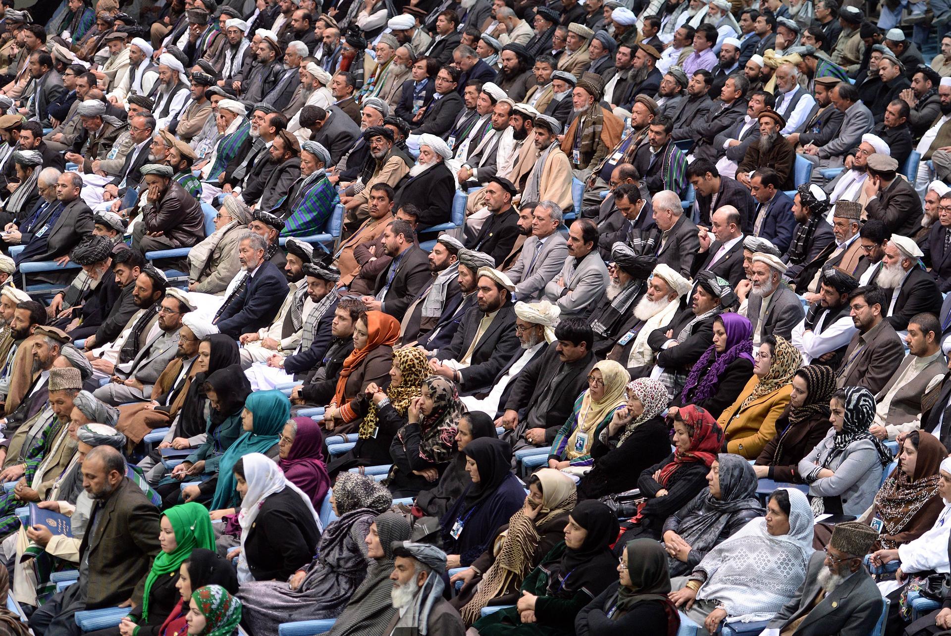 Afghan tribal elders and leaders listen during a four-day meeting in Kabul to debate the bilateral security agreement. Photo: AFP