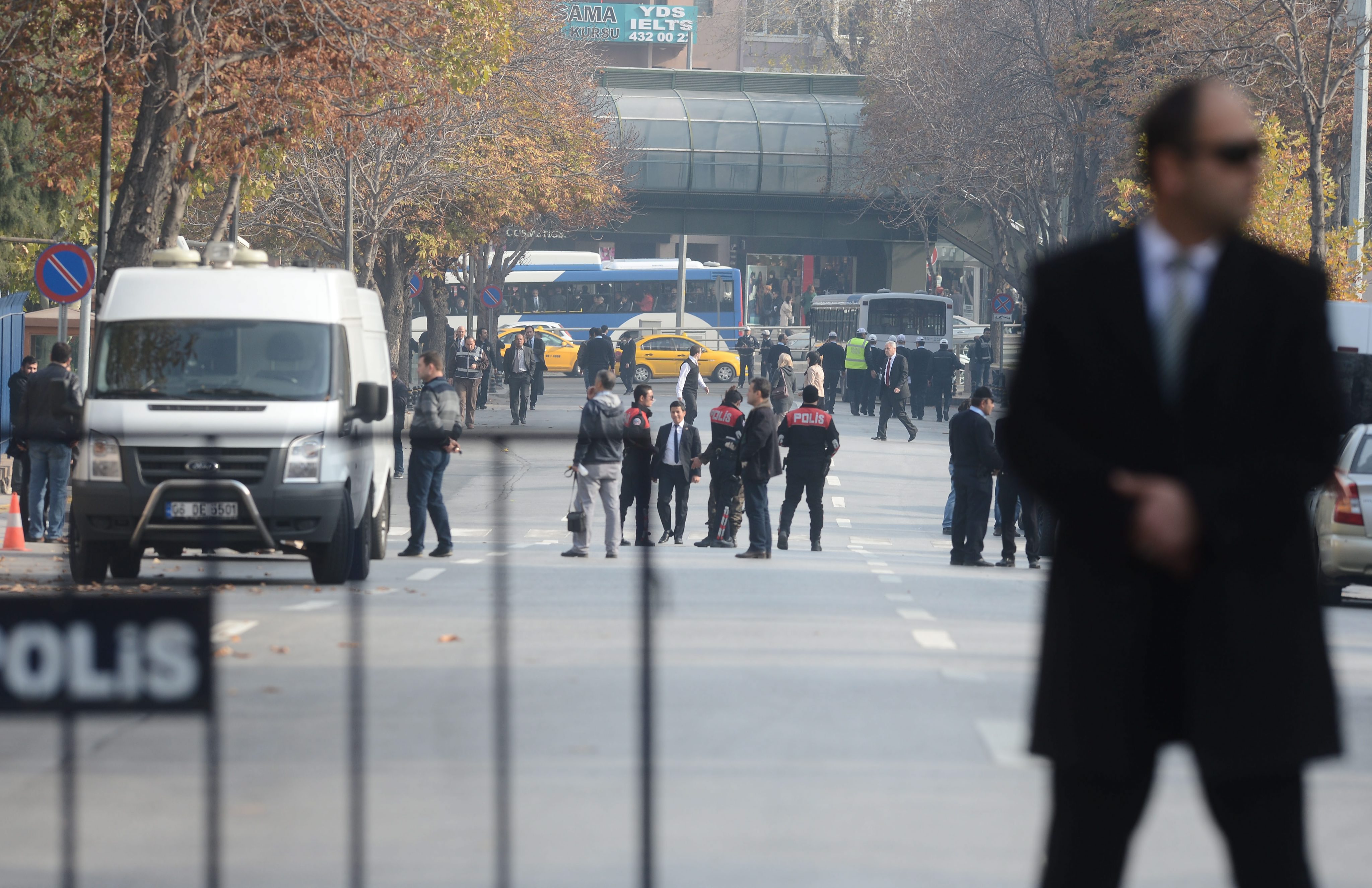 Turkish police secure the area after they shot and wounded a suspected suicide bomber close to the prime minister's office in Ankara. Photo: EPA