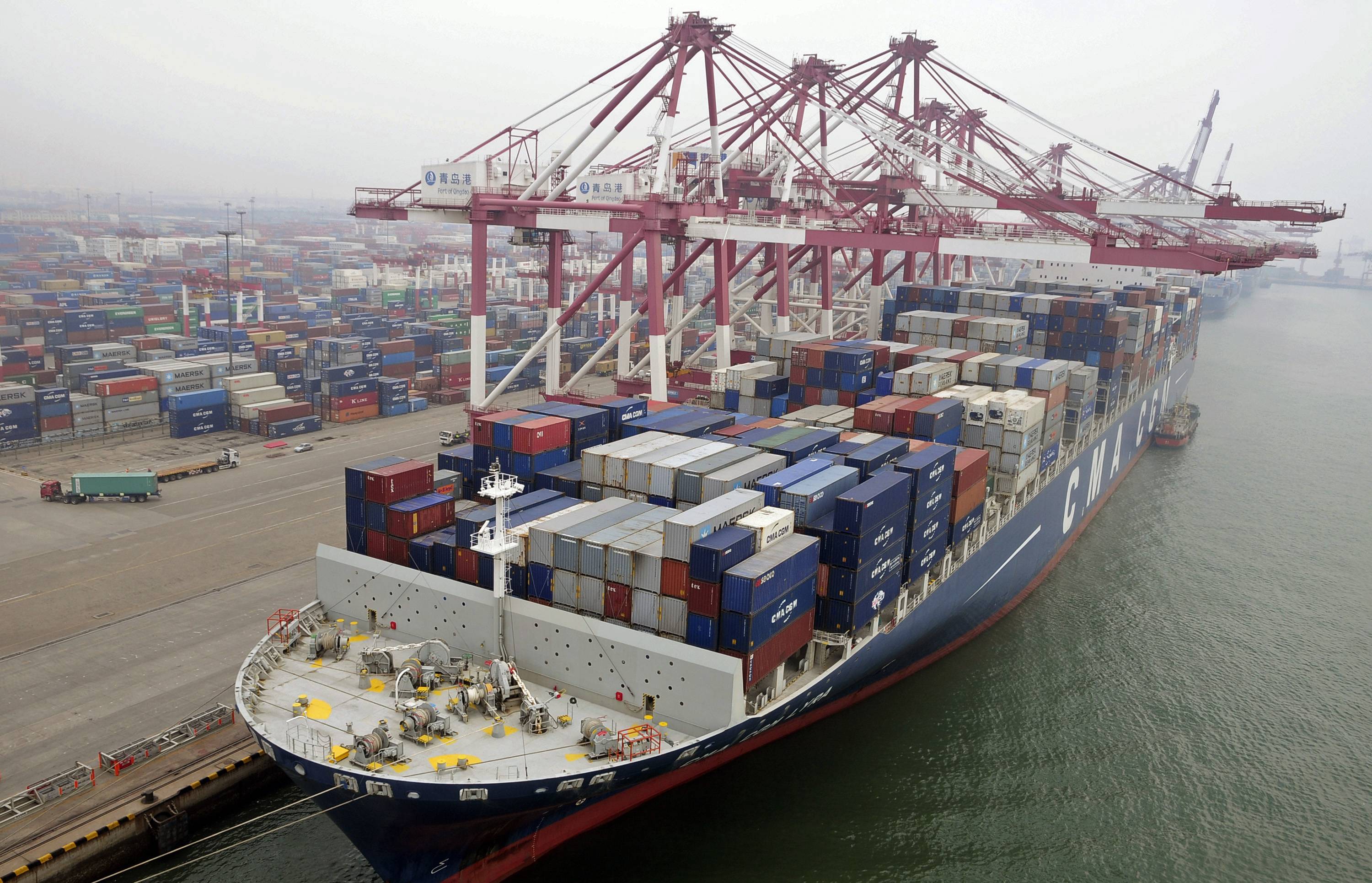 A cargo ship loaded with containers is seen anchored at a port in Qingdao, Shandong province. Photo: Reuters
