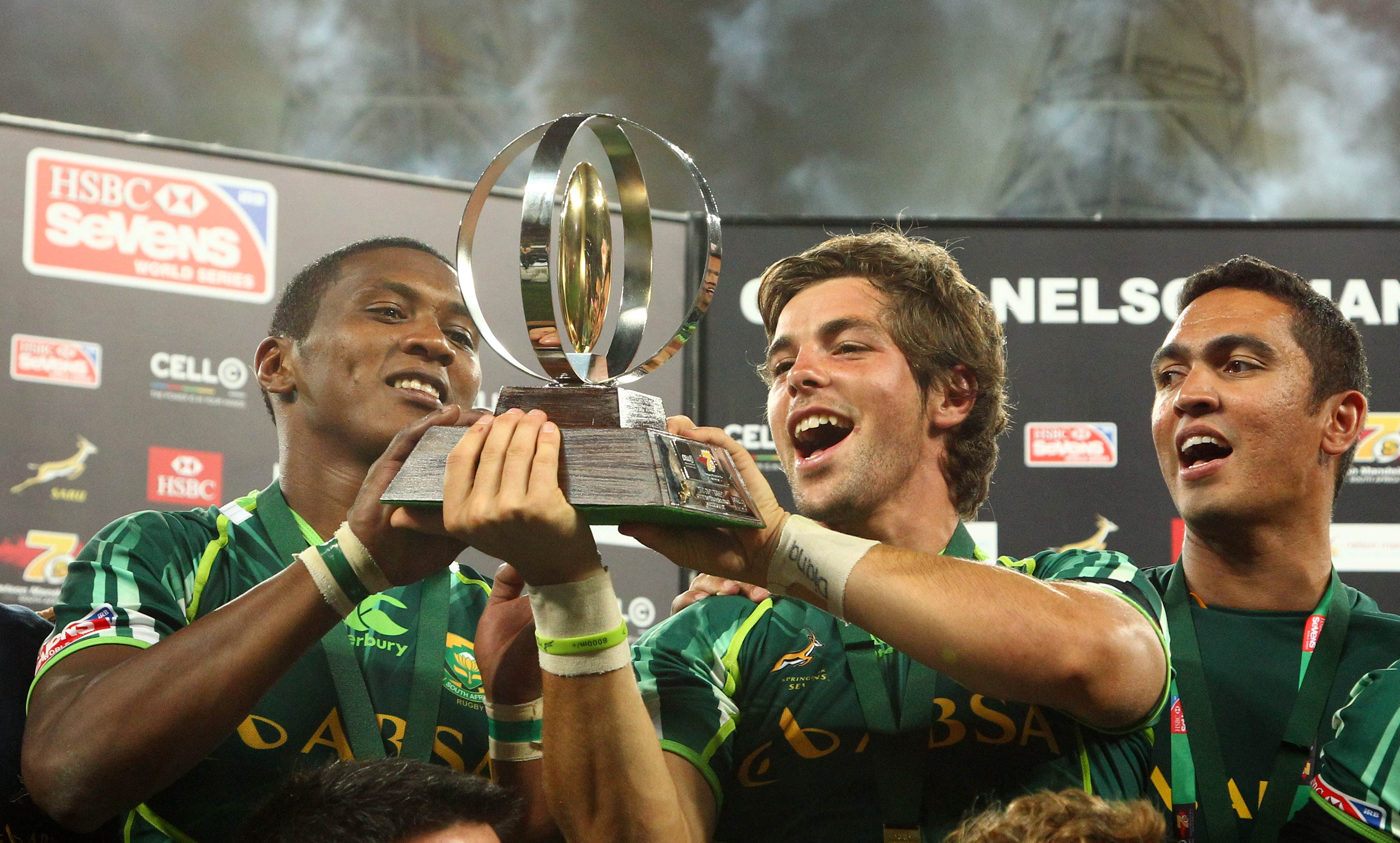 South Africa's players celebrate with the trophy after winning the final against New Zealand at the IRB Sevens at the Nelson Mandela Bay Stadium in Port Elizabeth. Photo: AFP