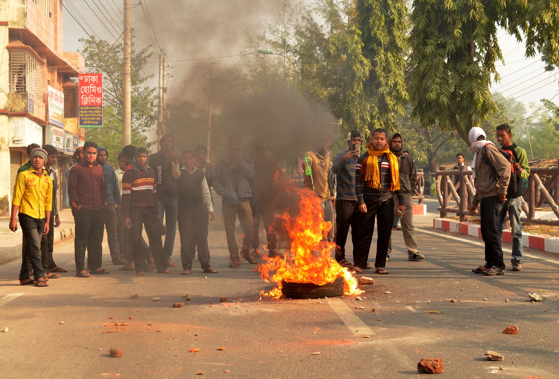 Bangladeshi Jamaat-e-Islami party supporters burn tires during a strike organised by the party to protest the execution of Abdul Quader Molla. Photo: AFP