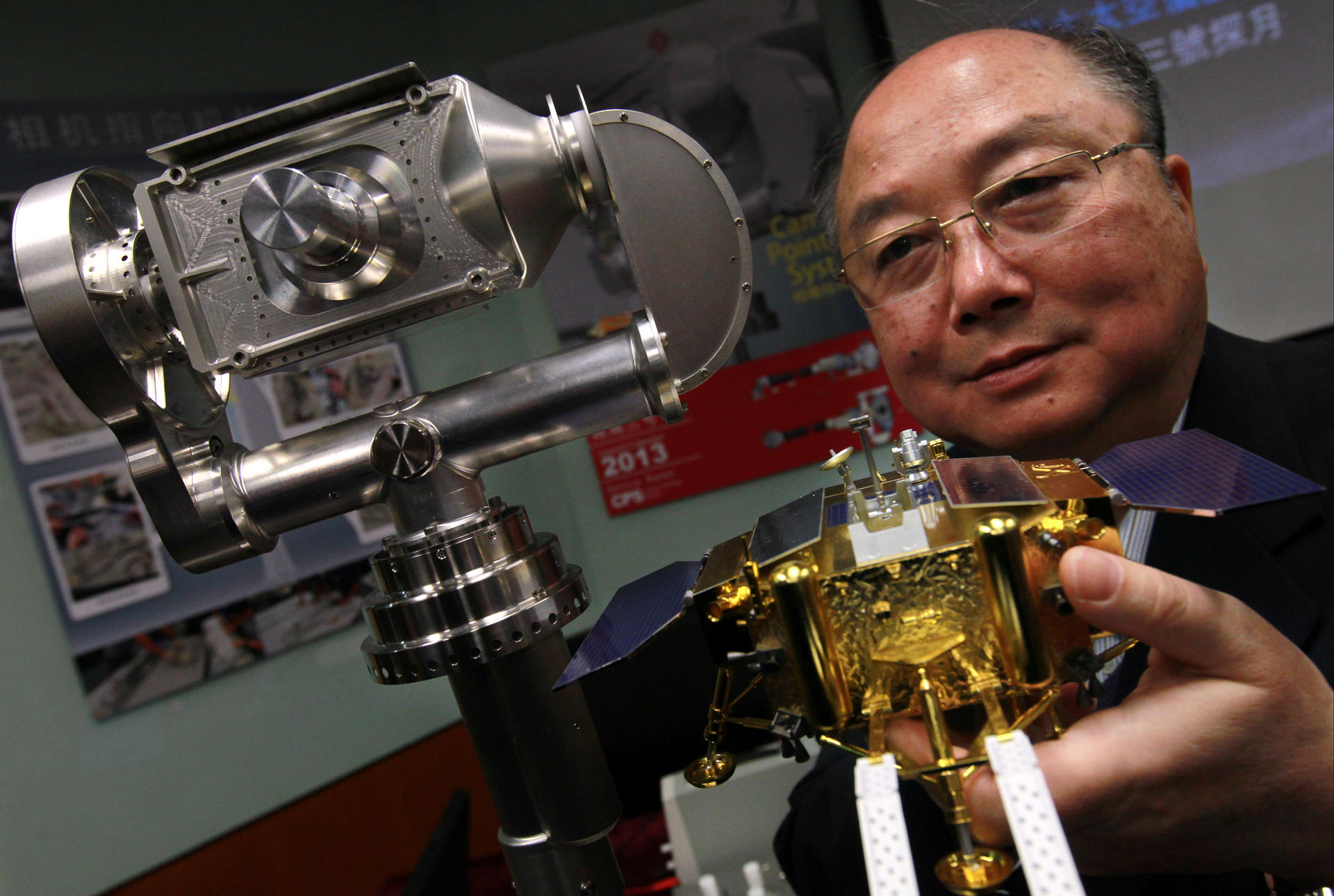 Professor Yung Kai-leung with his Camera Pointing System, which has proved instrumental to China's lunar landing. Photo: Dickson Lee