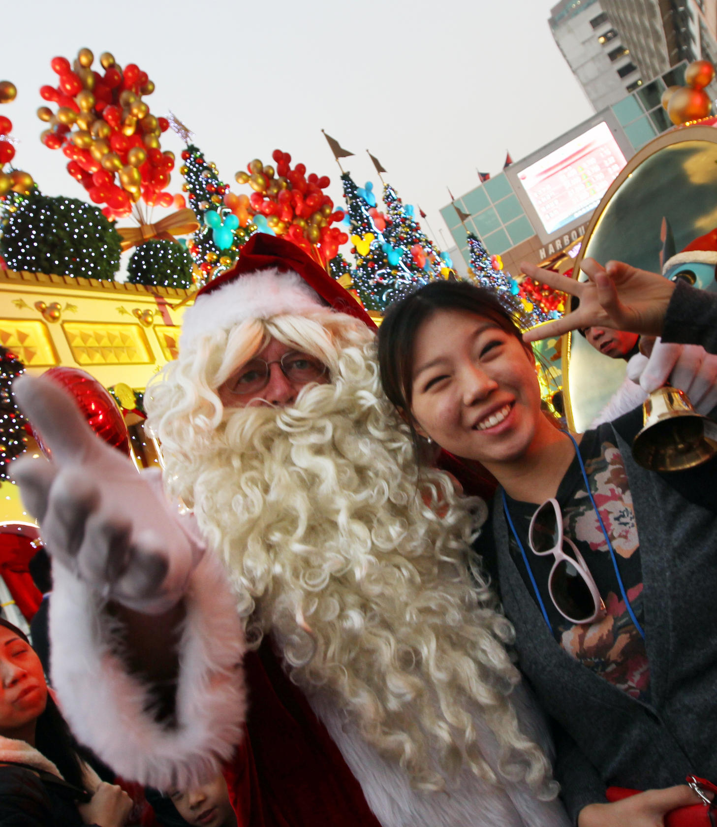 Santa took some time out to pose for photographs at Harbour City in Tsim Sha Tsui yesterday. Malls, theme parks and the Cultural Centre are the focus of attention for the holiday period. Photo: Felix Wong