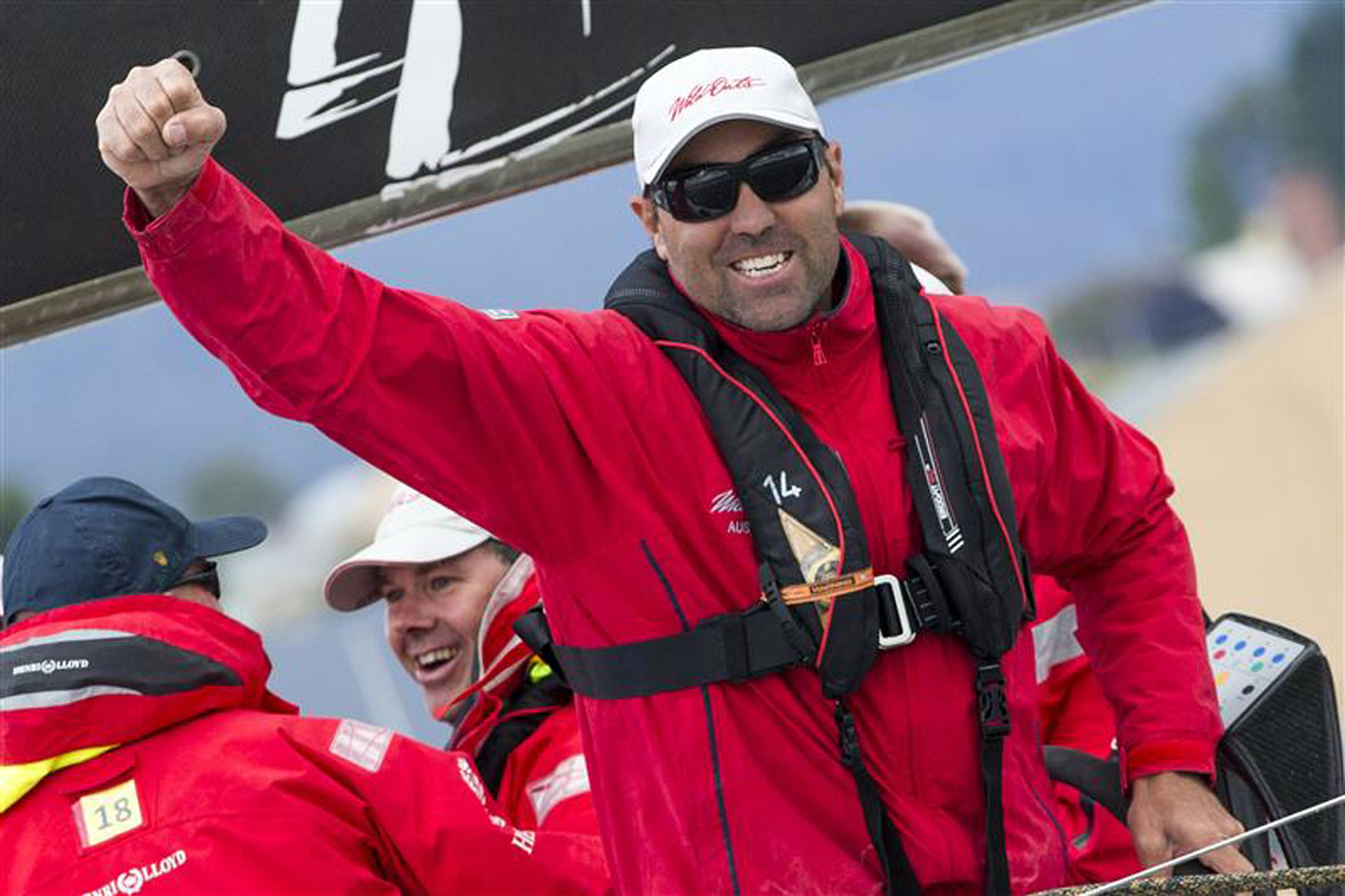 Wild oats X1 skipper Mark Richard celebrates after being the first to reach the finish line in the Sydney to Hobart race. Photo: AFP
