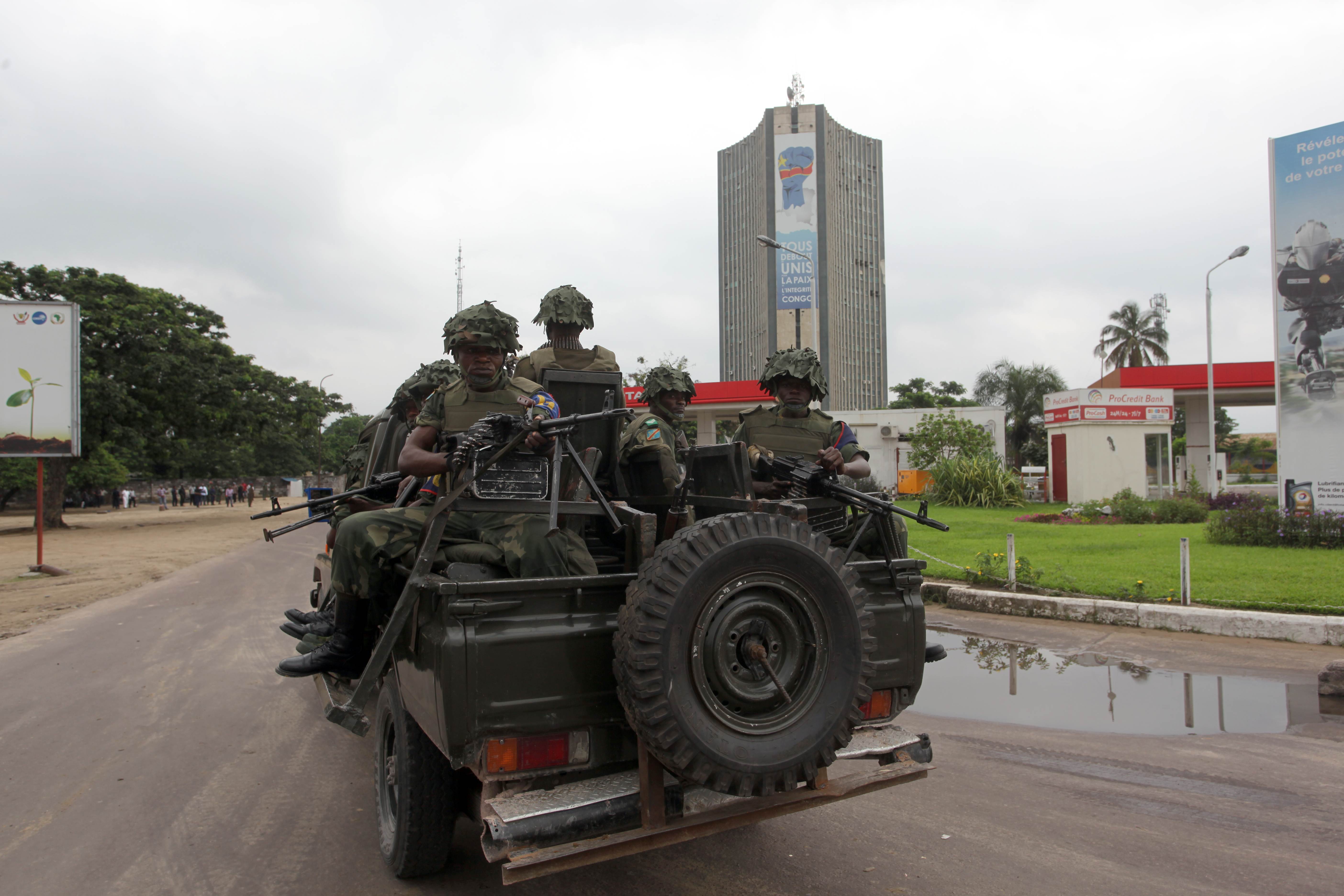 Soldiers of the Democratic Republic of Congo Army patrol after gunfire erupted at the state broadcaster in Kinshasa. Photo: AFP