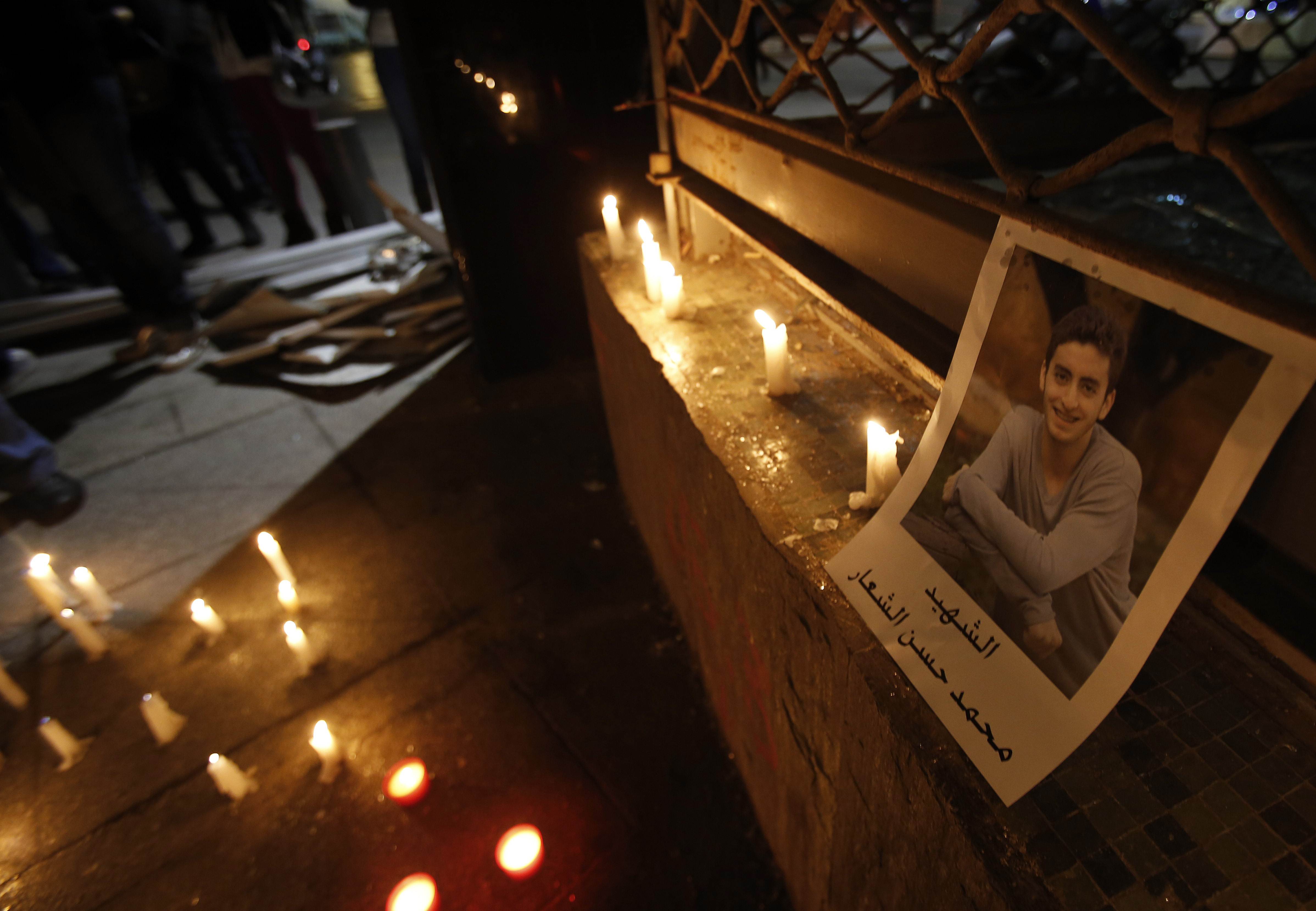  A portrait of 16-year-old Mohammad al-Chaar is seen during a candle-light vigil at the site of a car bomb that targeted former finance minister, Mohamed Chatah (Shatah), in Beirut on December 28, 2013. Photo: AFP