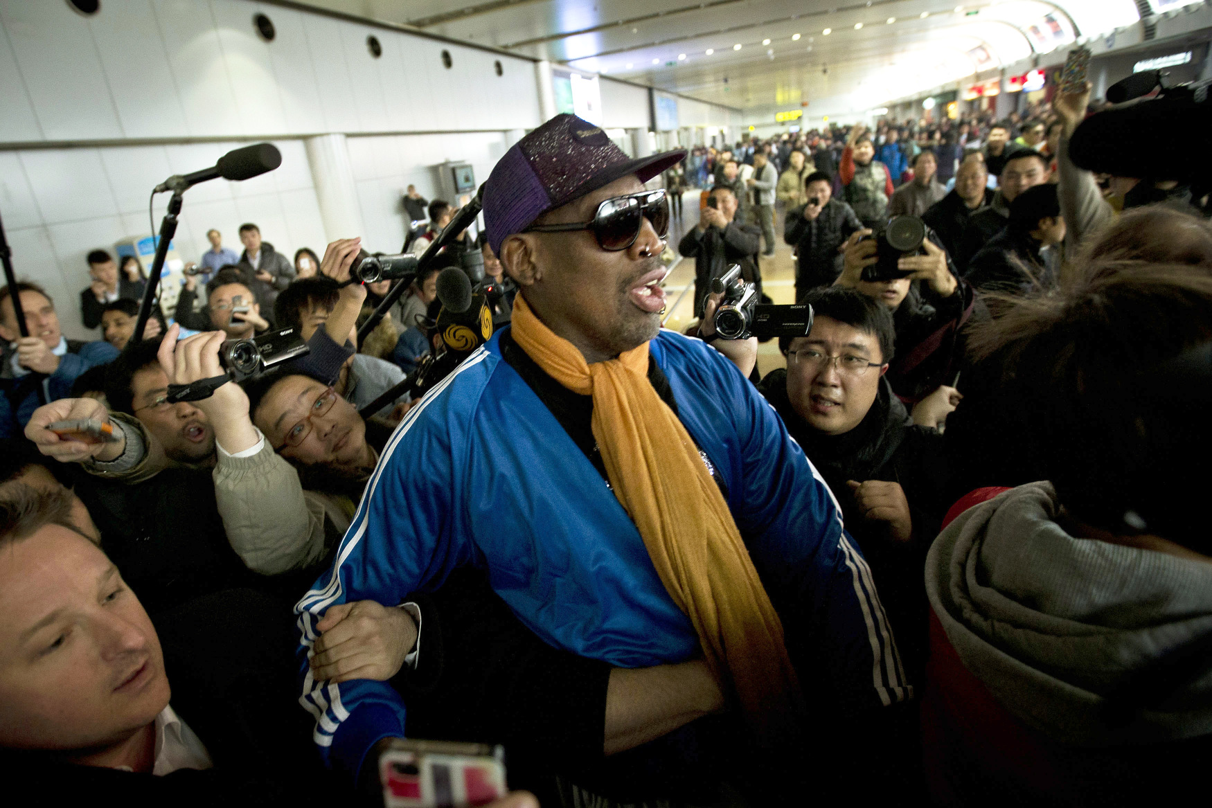 Former NBA basketball player Dennis Rodman arrives in Beijing from Pyongyang on Monday. Photo: AP