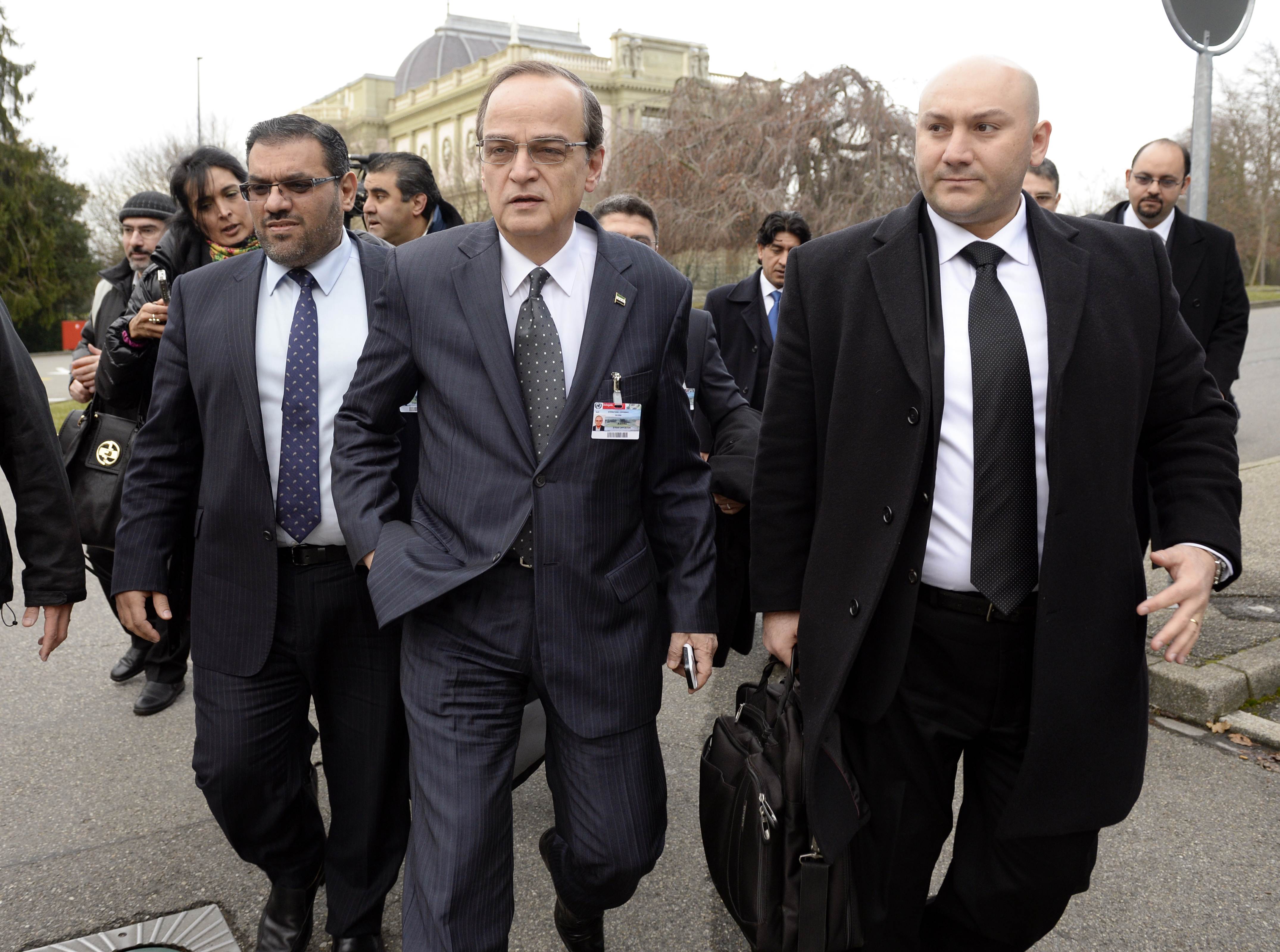 Syrian opposition chief negotiator Hadi al-Bahra (centre) arrives at the Geneva II peace talks on Saturday. Photo: AFP