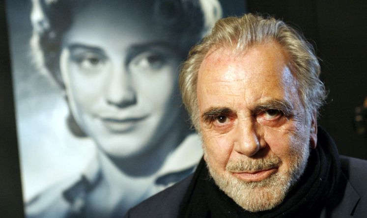 Maximilian Schell poses in front of a poster of his sister Maria in Frankfurt, Germany in 2007. Photo: AP