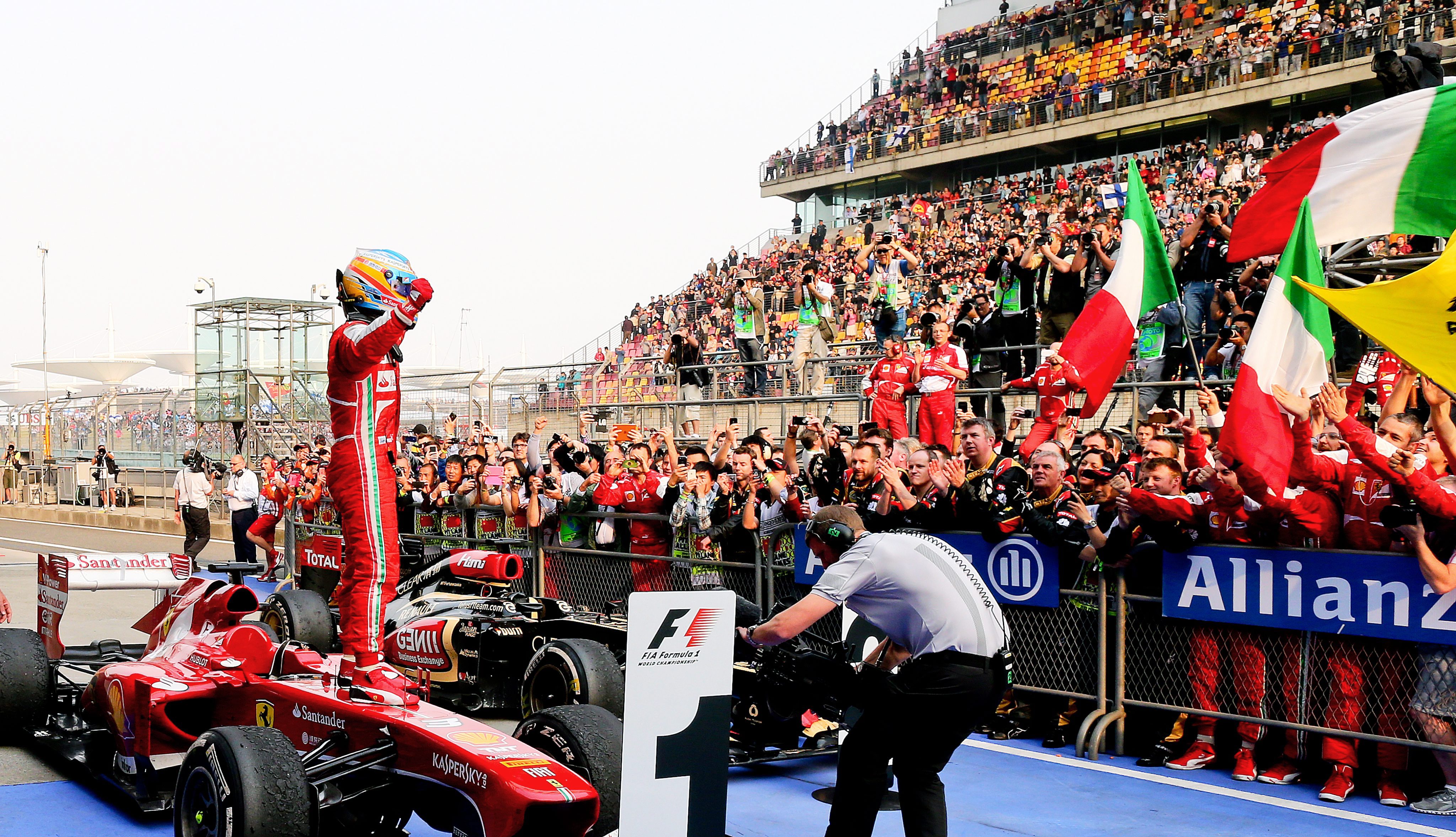 Spanish Formula One driver Fernando Alonso celebrates after winning the 2013 Chinese Formula One Grand Prix at the Shanghai International circuit in Shanghai on April 14, 2013. Photo: EPA
