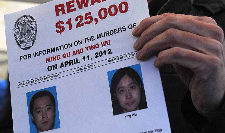 A poster offering a reward for information about the dual murder is seen at a 2012 press conference in Los Angeles. Photo: Xinhua