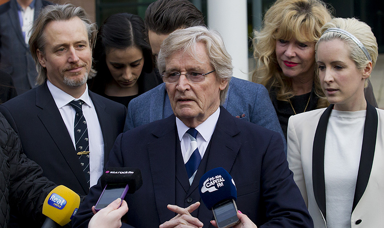 British actor William Roache (centre), talks to the press in Preston, England on Thursday after being found not guilty on sexual offences charges. Photo: AP