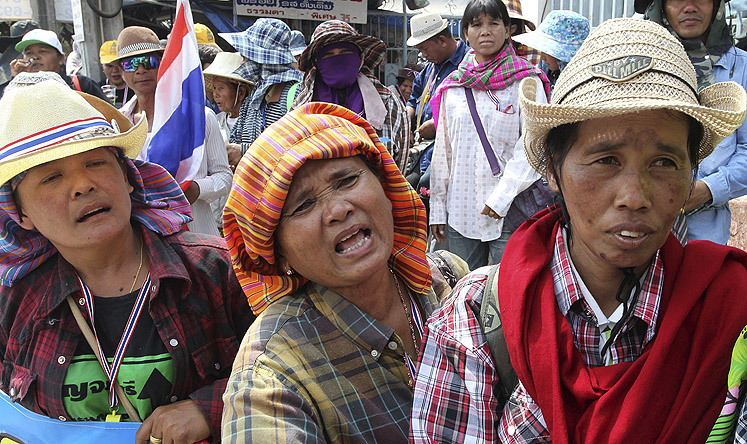 Thai farmers rally outside the Commerce Ministry in Bangkok on Thursday. Photo: AP