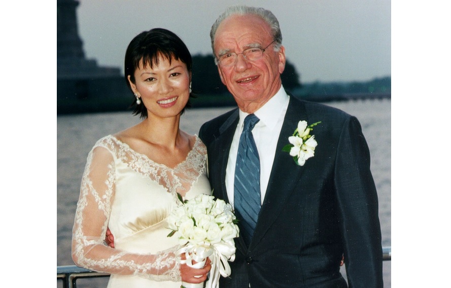 Newly-married couple, News Corporation Chairman Rupert Murdoch and Wendi Deng pose near the Statue of Liberty in this 1999 file picture. Photo: Reuters