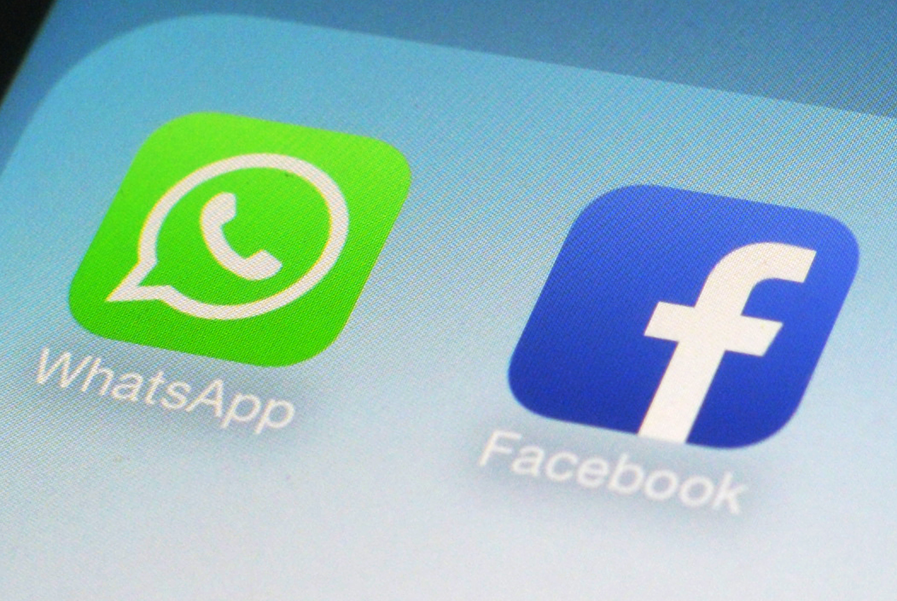 This Wednesday, Feb. 19, 2014 photo shows the WhatsApp and Facebook app icons on an iPhone in New York. Photo: AP