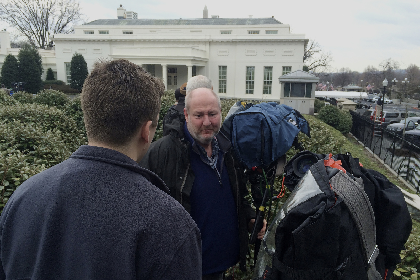 Television news cameramen point their cameras to the West Wing entrance of the White House in Washington, Friday, Feb. 21, 2014, hoping to catch Tibetan spiritual leader the Dalai Lama arriving for a closed press meeting with President Barack Obama. Photo: AP