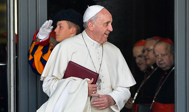 Pope Francis leaves after meeting cardinals at the Vatican on Friday, Photo: AFP