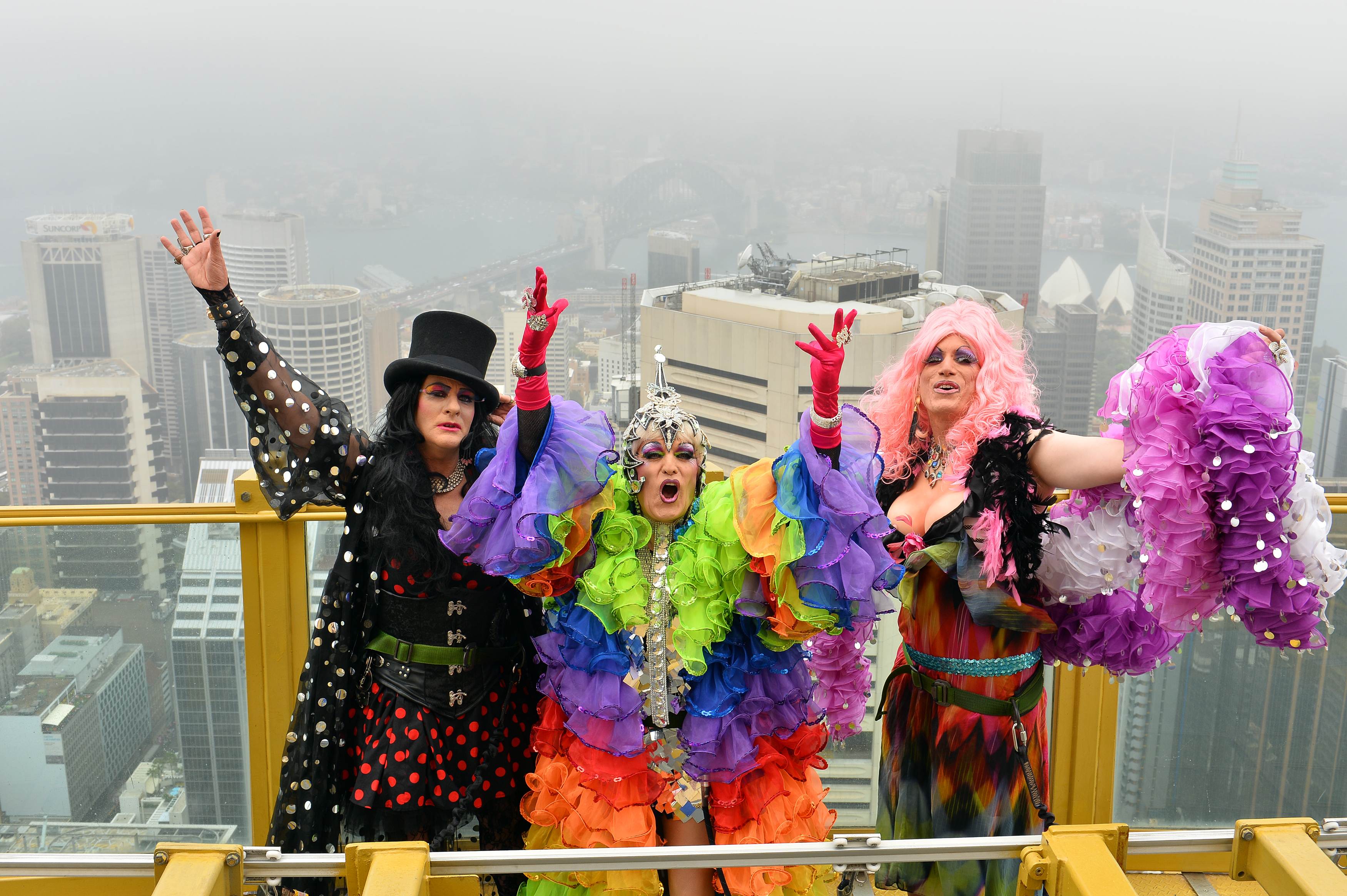 Drag Queens Dawn Service (L), Miss 3D (C) and Roma Therapy (R) pose during a photo shoot on the Observation Deck, 268 meters above street level, at the Sydney Tower Eye on February 27, 2014. Photo: AFP