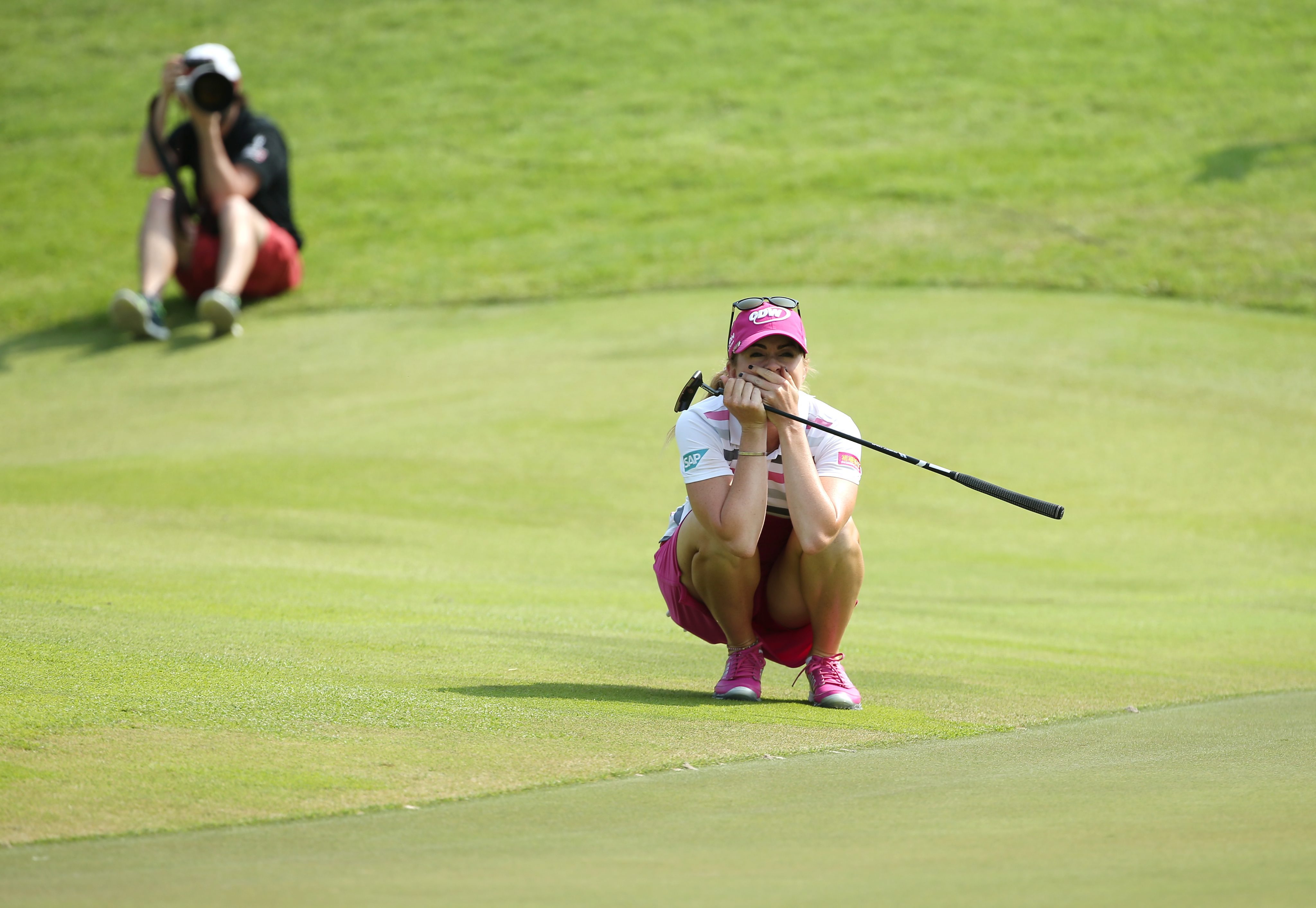 Paula Creamer celebrates after sinking a 75-foot eagle putt to win the HSBC Women's Championships at the Sentosa Golf Club in Singapore. Photo: EPA